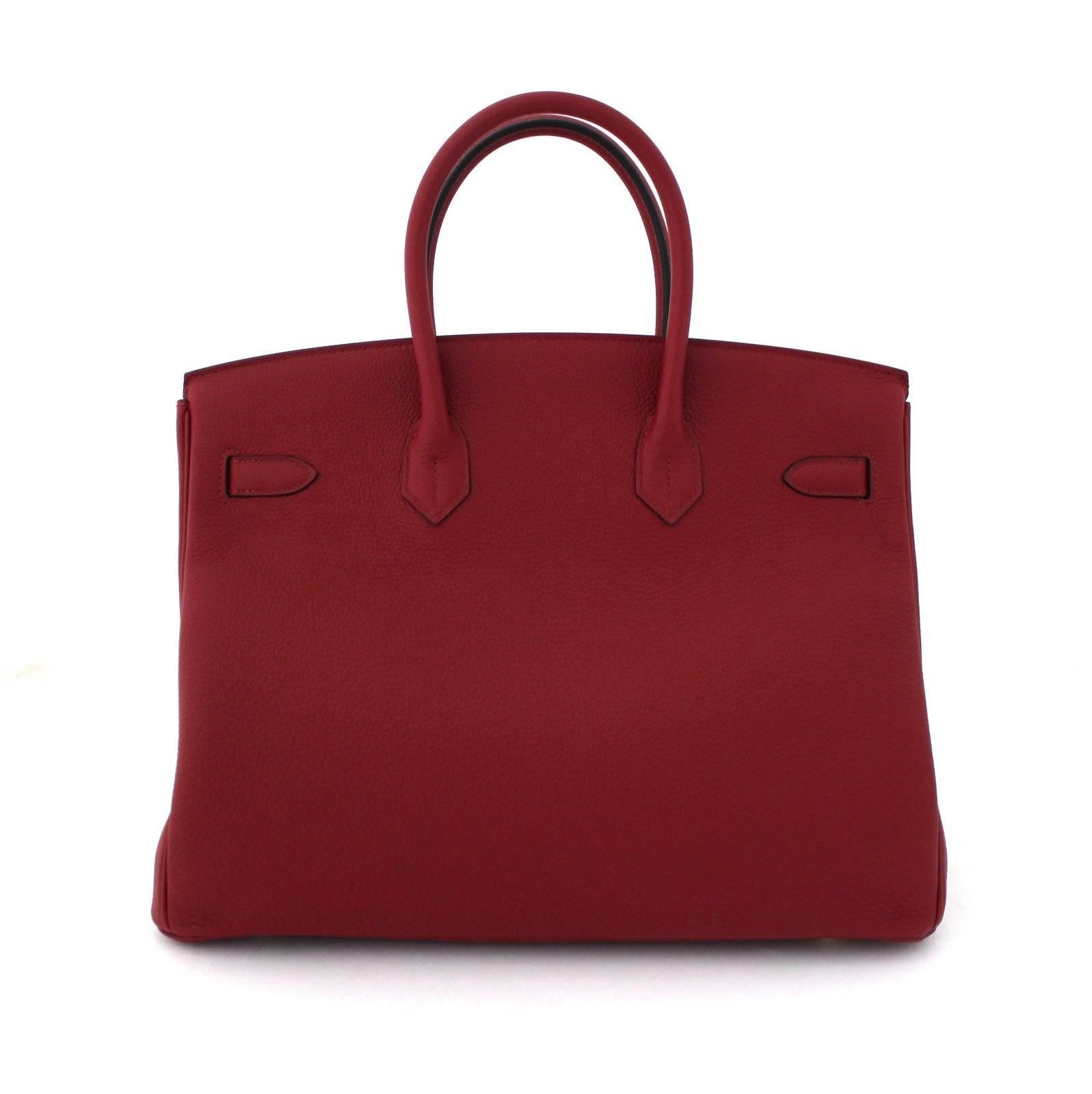 Pristine, store fresh condition (plastic on hardware) Hermès Birkin Bag in ROUGE GRENAT Togo Leather, GHW 35 cm, x stamp
Purchase includes padlock, keys, clochette, protective felt, raincoat, dust bags and Hermès box with tissue. 
Crafted by