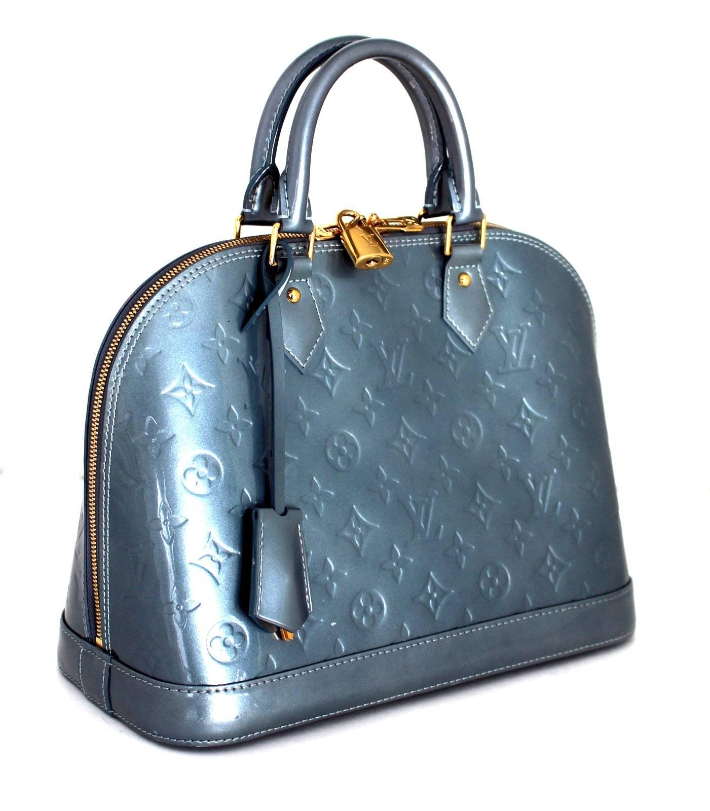 Louis Vuitton GIVRE Vernis Monogram Alma PM - retail $2,350.00.
Mint overall condition; carefully stored, rarely carried.
An icon of the LV collection, the Alma is a currently available style and considered a true classic.  
Silver blue grey