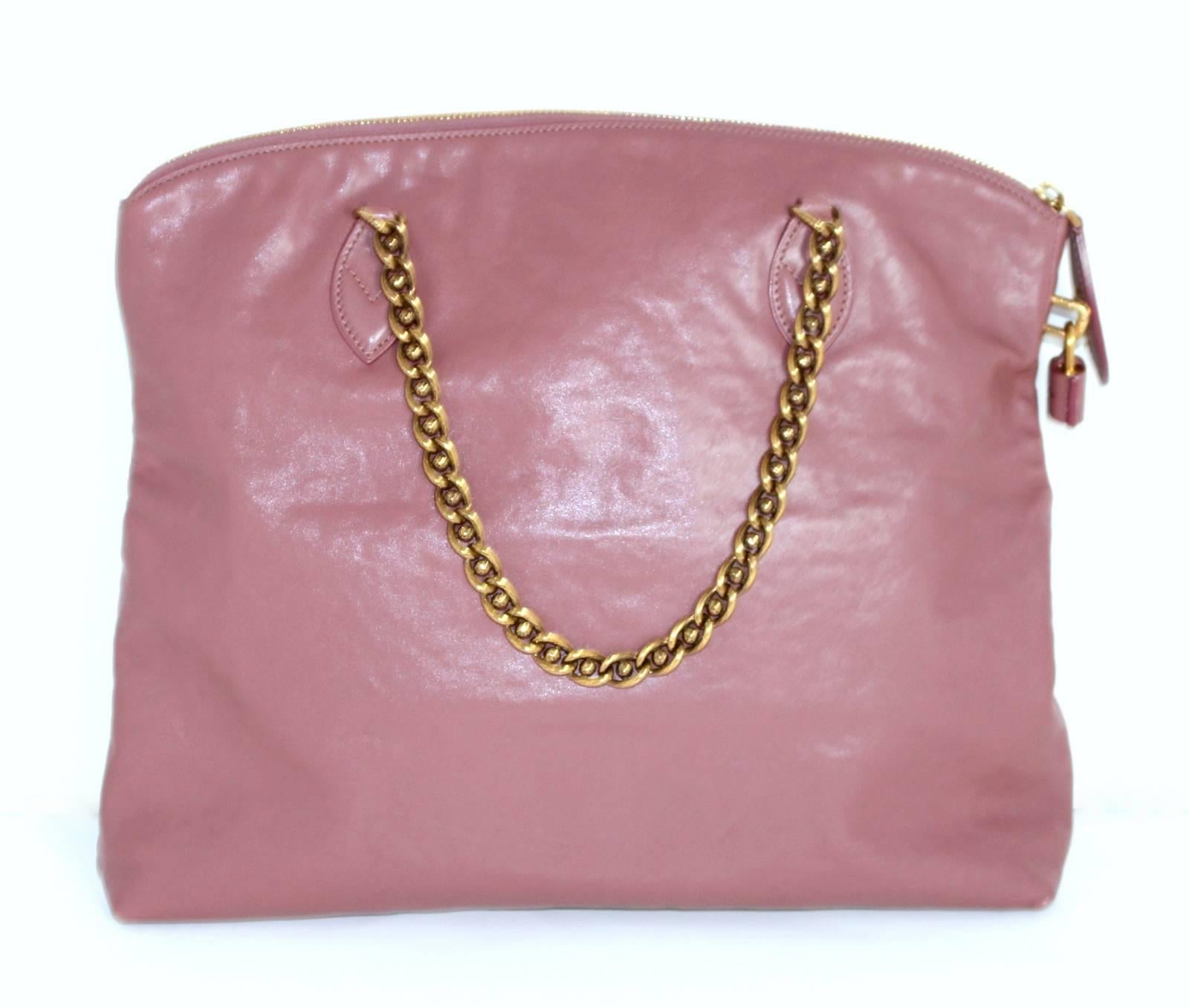 Louis Vuitton Rose Boudoir Leather Lockit Chain Bag- Retail price $2,860.00   Fall Winter 2013-2014 Collection
Mild corner rubbing only signs of prior ownership.  
Soft mauve leather is remarkably neutral and wearable year round.  Beautiful