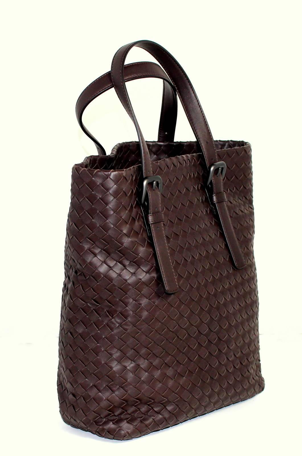 Bottega Veneta Brown Leather Classic Tote- Estimated Current Value $2,400
EXCELLENT overall condition.  Minor corner wear and creasing from storage. 
 
Rich brown leather bucket style tote is woven in intrecciato style.  Double leather straps