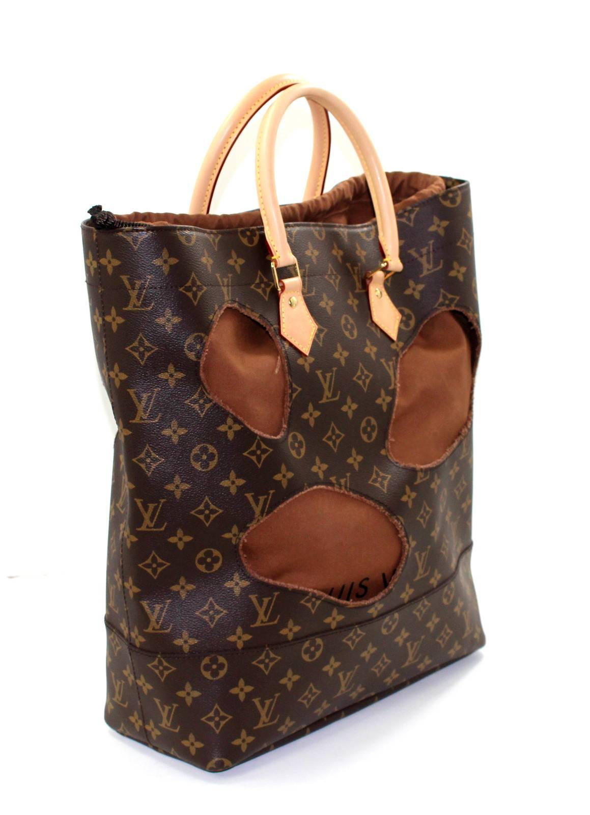 Louis Vuitton Kawakubo Runway Tote- Brand New, Pristine
Specially designed by Rei Kawakubo for the Celebrating Monogram collection, this rare piece is totally sold out everywhere.   
Brown and tan LV monogram canvas tote has large cut outs adding
