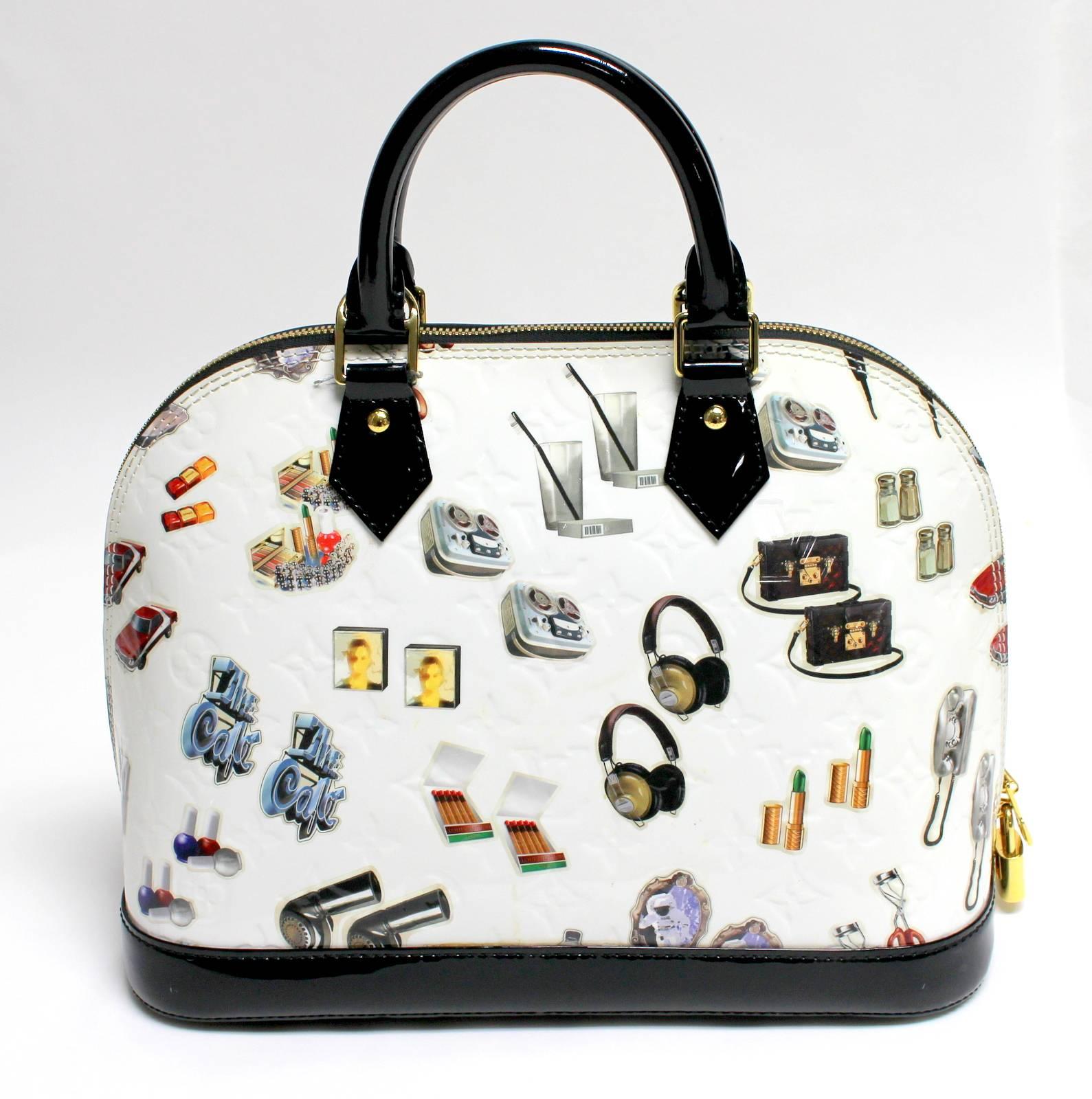Louis Vuitton White Vernis Stickers Alma PM Satchel
Spring Summer 2015 collection- EXCELLENT PLUS; rarely carried.  
Feminine domed top Alma in white with colorful animation “sticker” pairs on front and rear.  Black patent leather sturdy footed