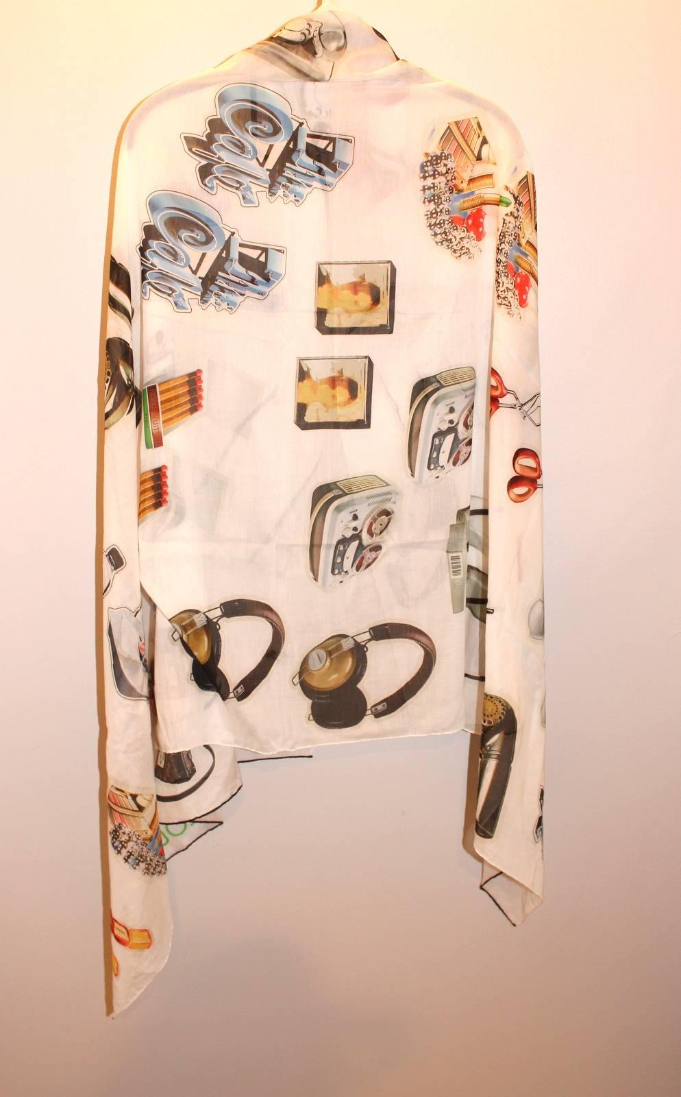 Louis Vuitton White Animation Stickers Stole- Pristine Retail $685.00

The whimsical scarf is from the Spring Summer 2015 collection.  It is a beautiful addition to any wardrobe.  
Silk and cotton white long stole is covered in multicolored
