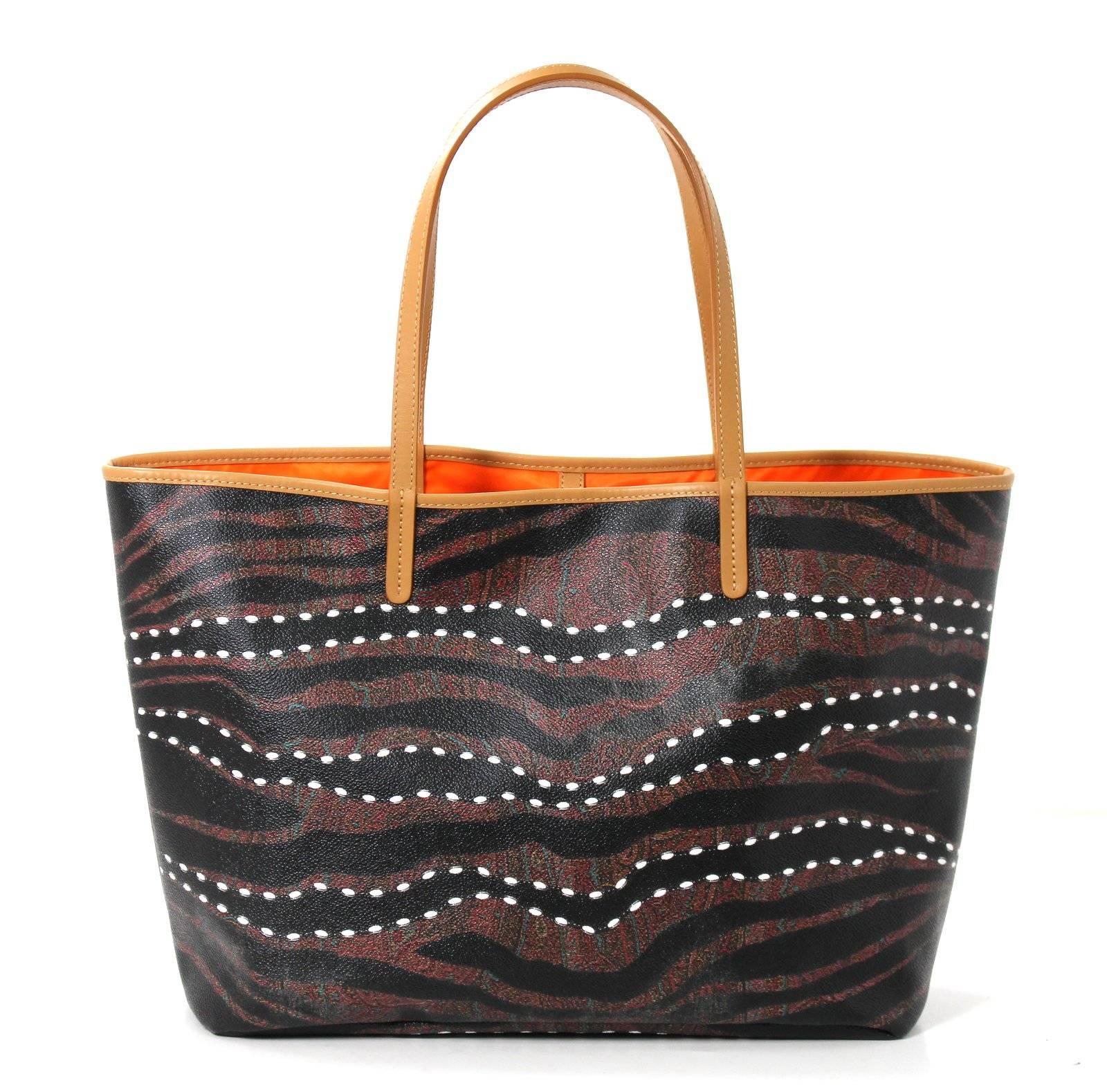 ETRO Paisley Tote- New, Never before Carried!!  Approximate retail $850.00
This ETRO tote is a classic silhouette in the medium size.  It features their signature paisley pattern with an overlay of black and white wavy dot striping that adds an