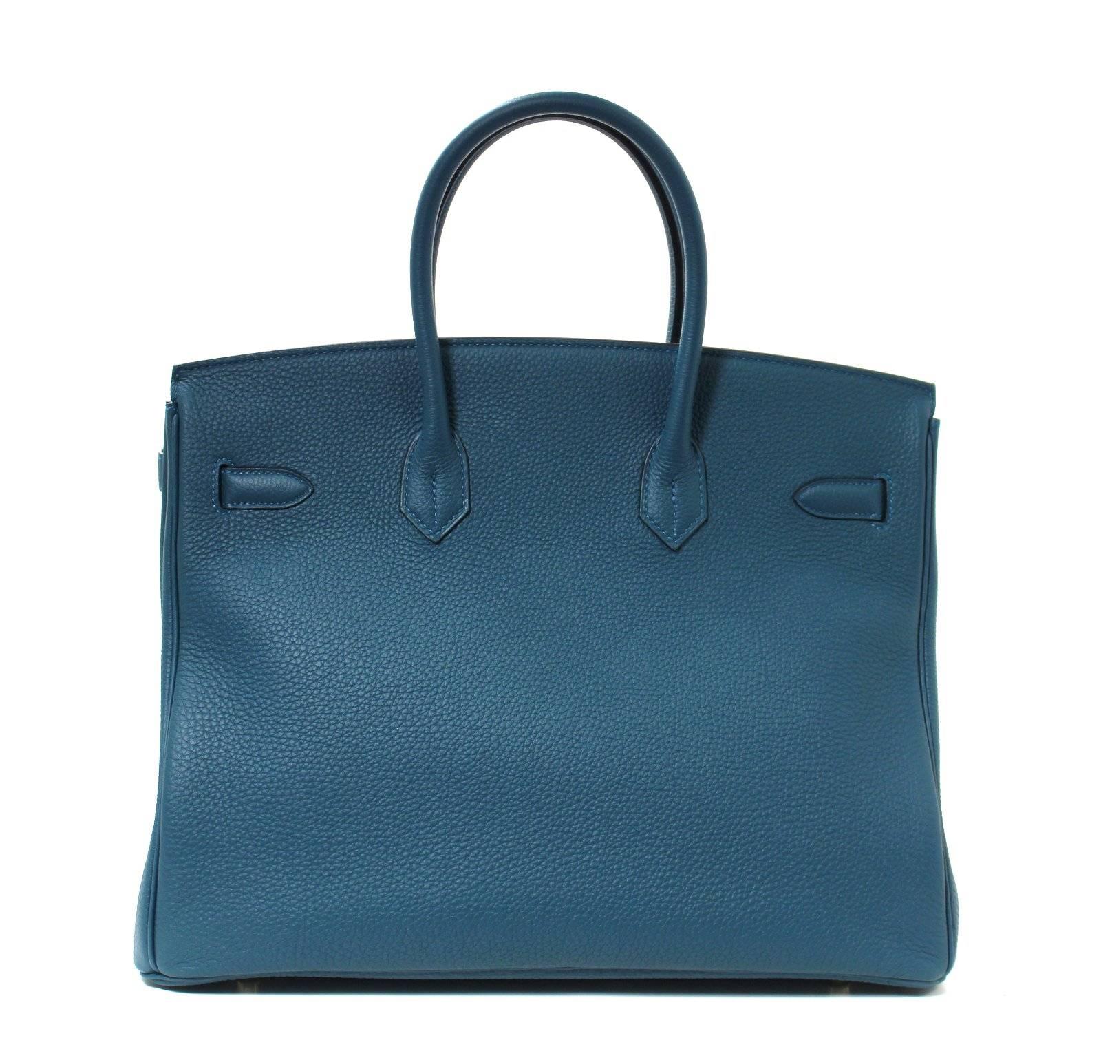 Pristine, store fresh condition (plastic on hardware) Hermès Birkin Bag in BLUE COLVERT Togo Leather with GOLD hardware, 35 cm size T stamp
Crafted by hand and considered by many as the epitome of luxury items, Birkins are in extremely high demand