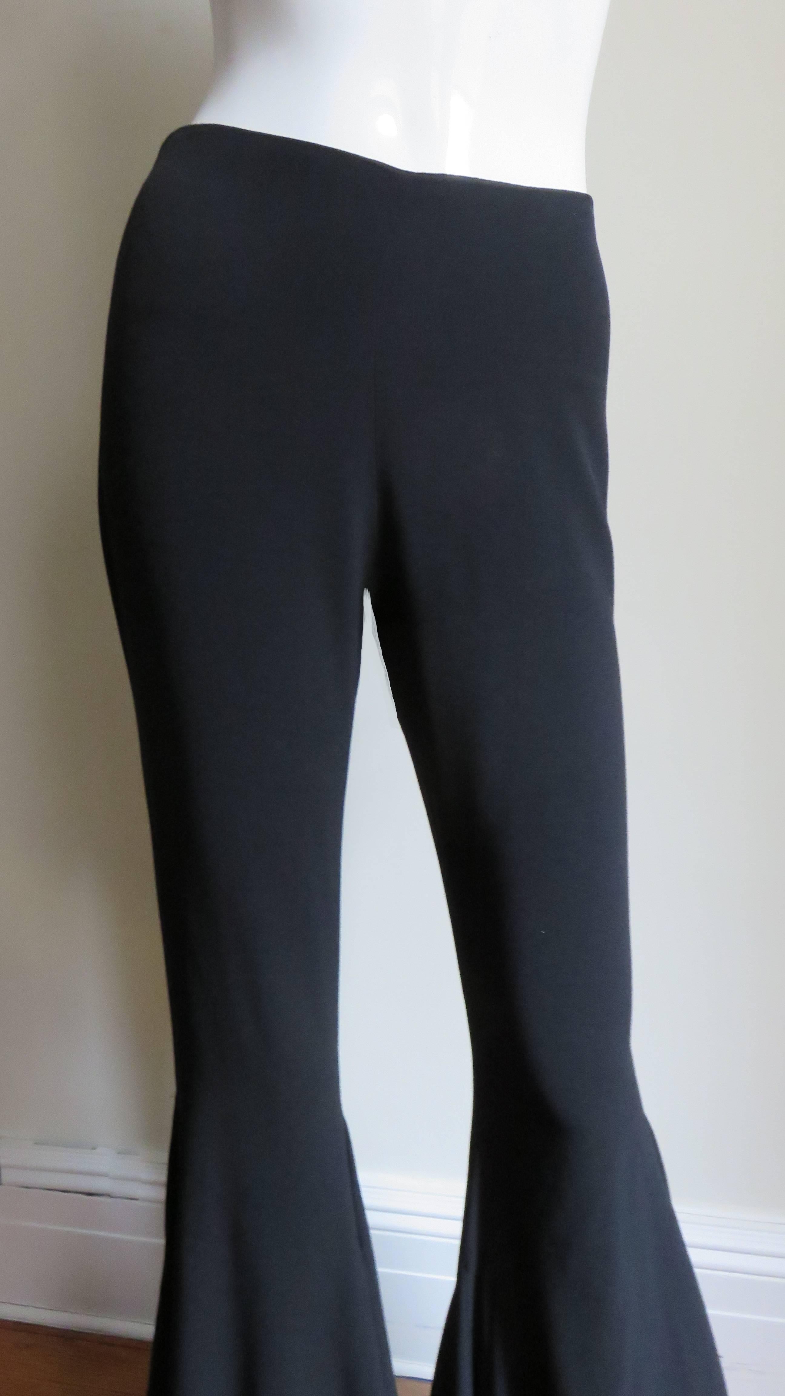A great pair of black silk pants from Italian designer Cailan'D.  They are fitted from the waist through to above the knees where they dramatically flare via inserts and gores to the hem.  They have a side zipper.
Excellent,unworn with tags attached