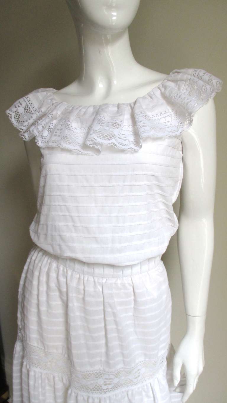 A fabulous skirt and top set from Alberto Capraro in a fine white cotton with a line pattern created by tiny horizontal folds in the fabric and Guipure lace.  He was an American designer who worked with Oscar de la Renta and Lily Dashe branching out