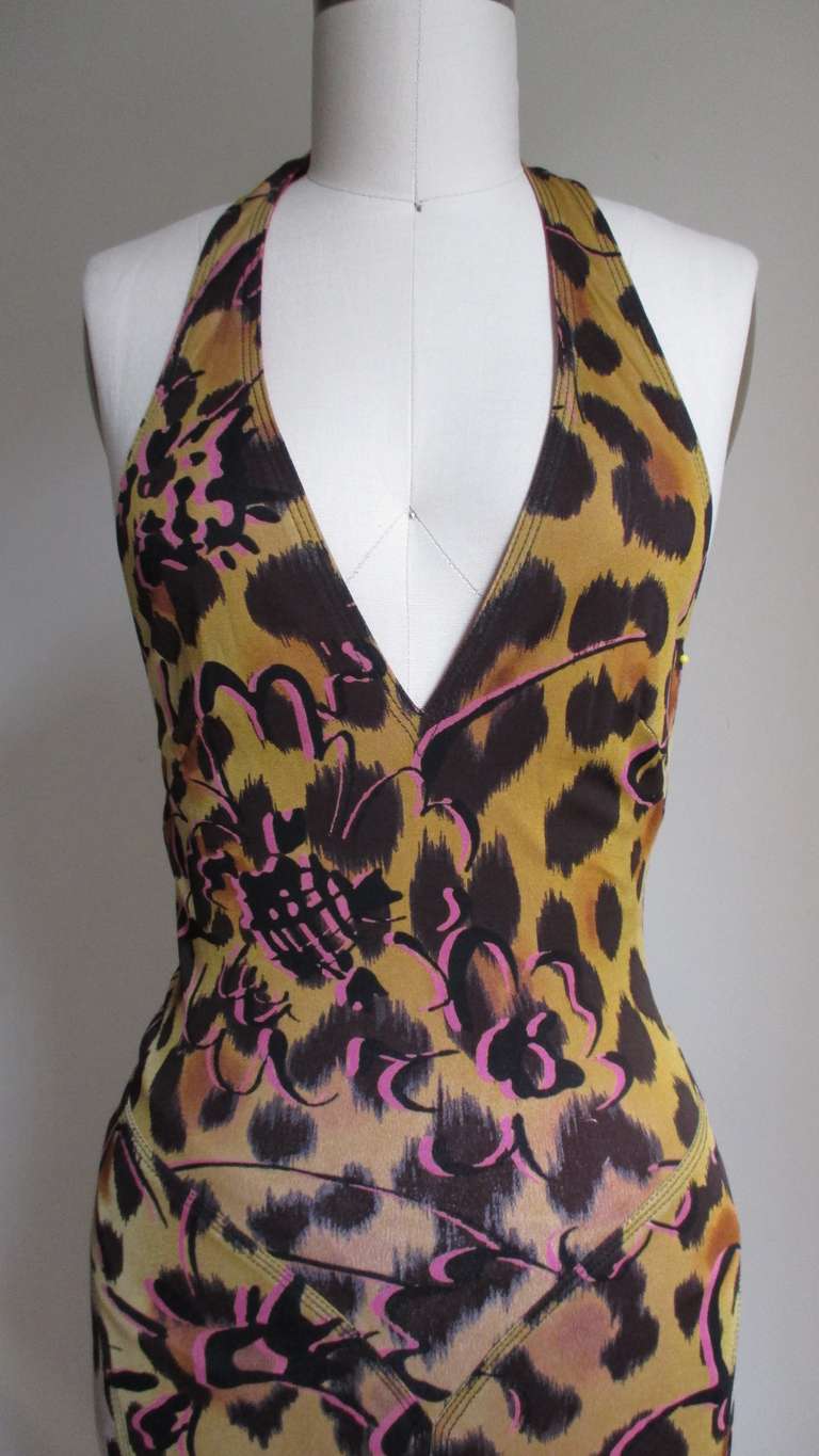 Another beautiful low cut plunge dress from Gianni Versace Couture in silk jersey.  The pattern is leopardesque with abstract shapes that hint at flowers in pink.  The front comes to a V at hip level, a flattering seam placement.  The skirt is