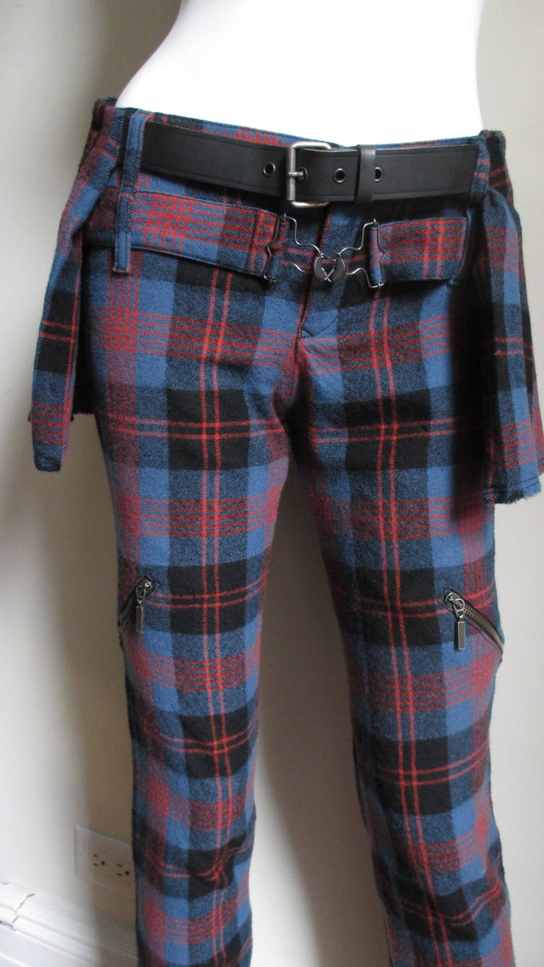 A fabulous pair of wool flannel pants from Alexander Mcqueen's McQ line in blue, red and black plaid.  These are incredible with so much detail- large  slanted front thigh zippers, ankle zippers and back zipper pockets.  Double layered belt loops to
