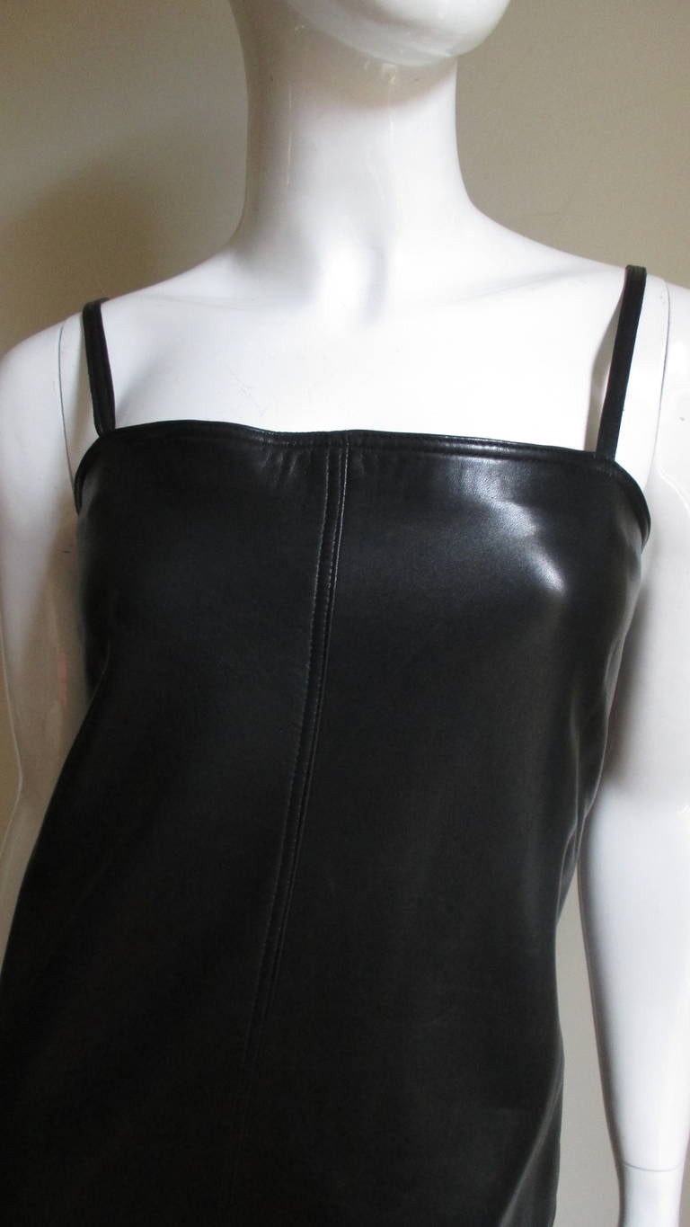 A soft, supple black leather dress with straps and 2