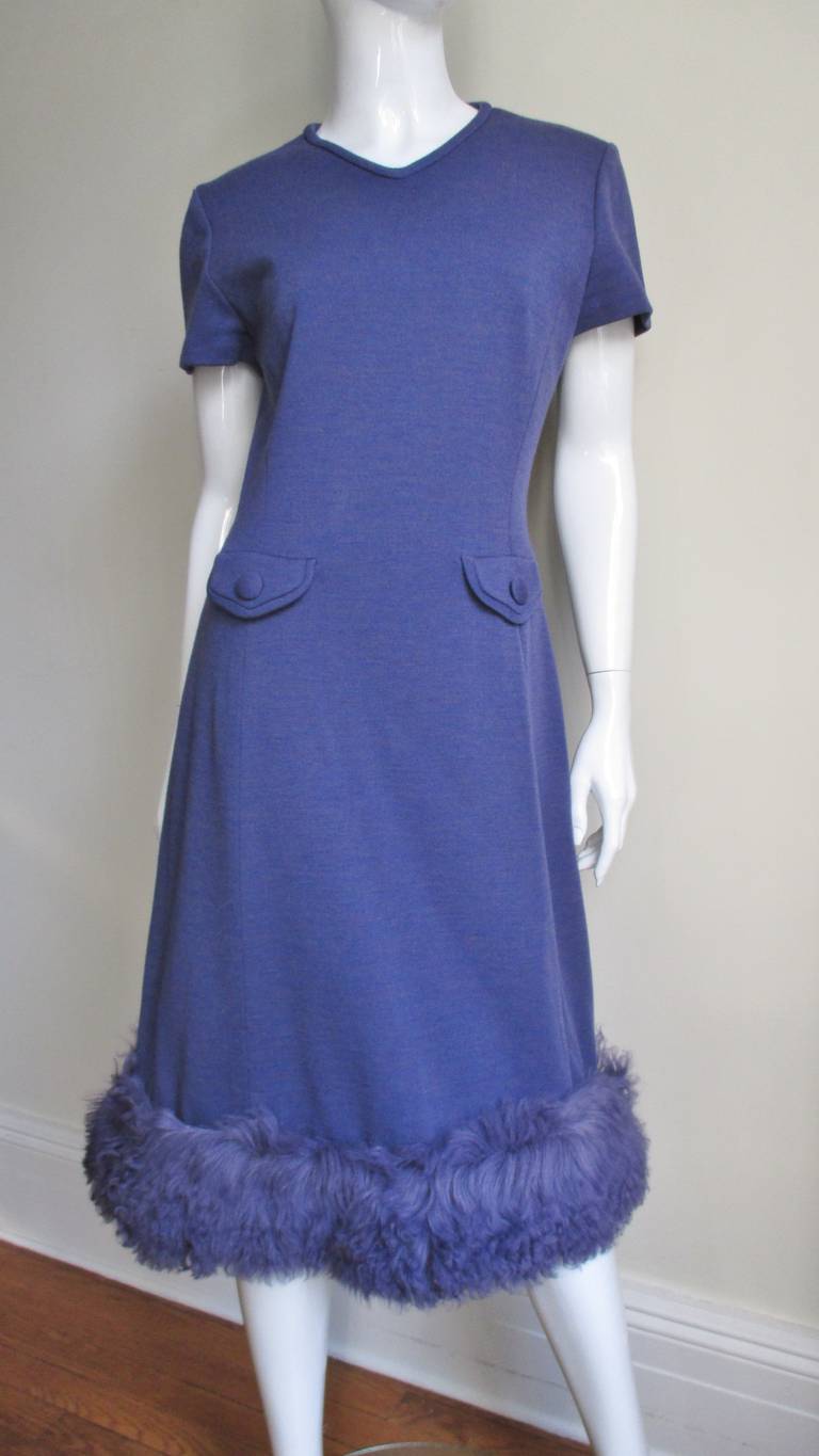 Gorgeous coat and dress set in a beautiful purple wool knit from Lilli Ann.  Amazing dyed to match swaths of Mongolian Lamb fur adorn the hem of the dress, the coat collar and cuffs.  The short sleeved V neck dress is princess seamed for shape and