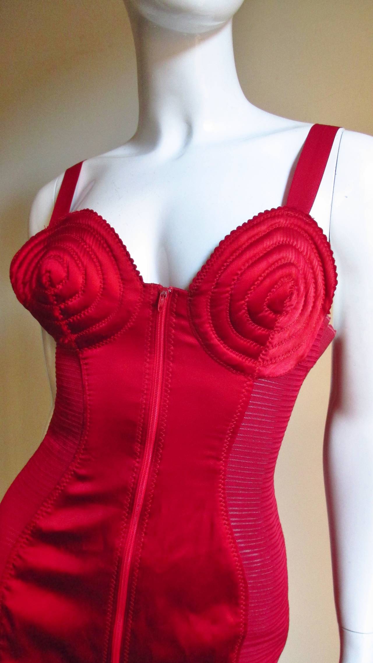 Fabulous bright cherry red dress from Jean Paul Gaultier from the Madonna 'like a virgin' days when underwear moved to outer wear. It's corset style with multi top stitched bra cups (appropriate for a smaller bust due to their depth) with wide satin