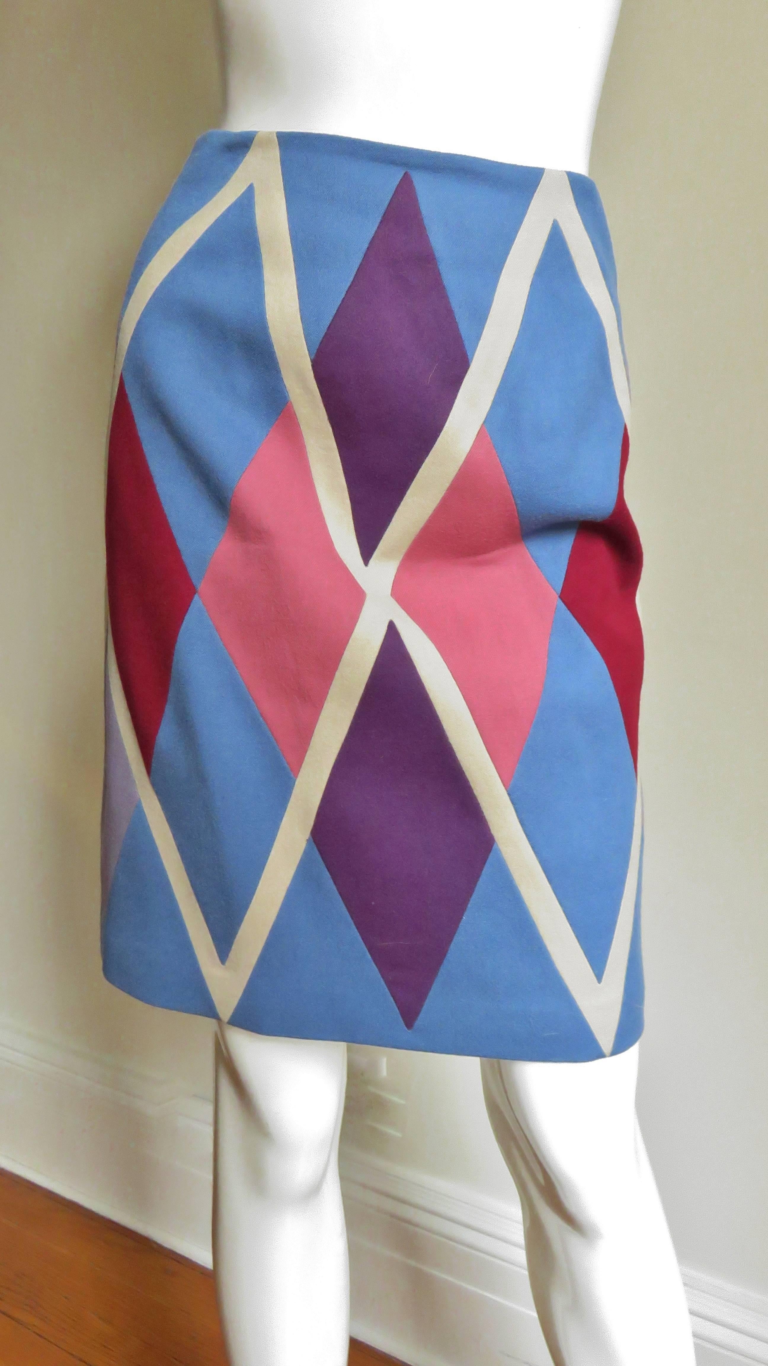 A fabulous wool skirt in a blue, purple, pink and off white argyle pattern.  It is a beautiful color combination and each color is a separate piece assembled and sewn together to create a large argyle pattern on the front and the back.  It is a