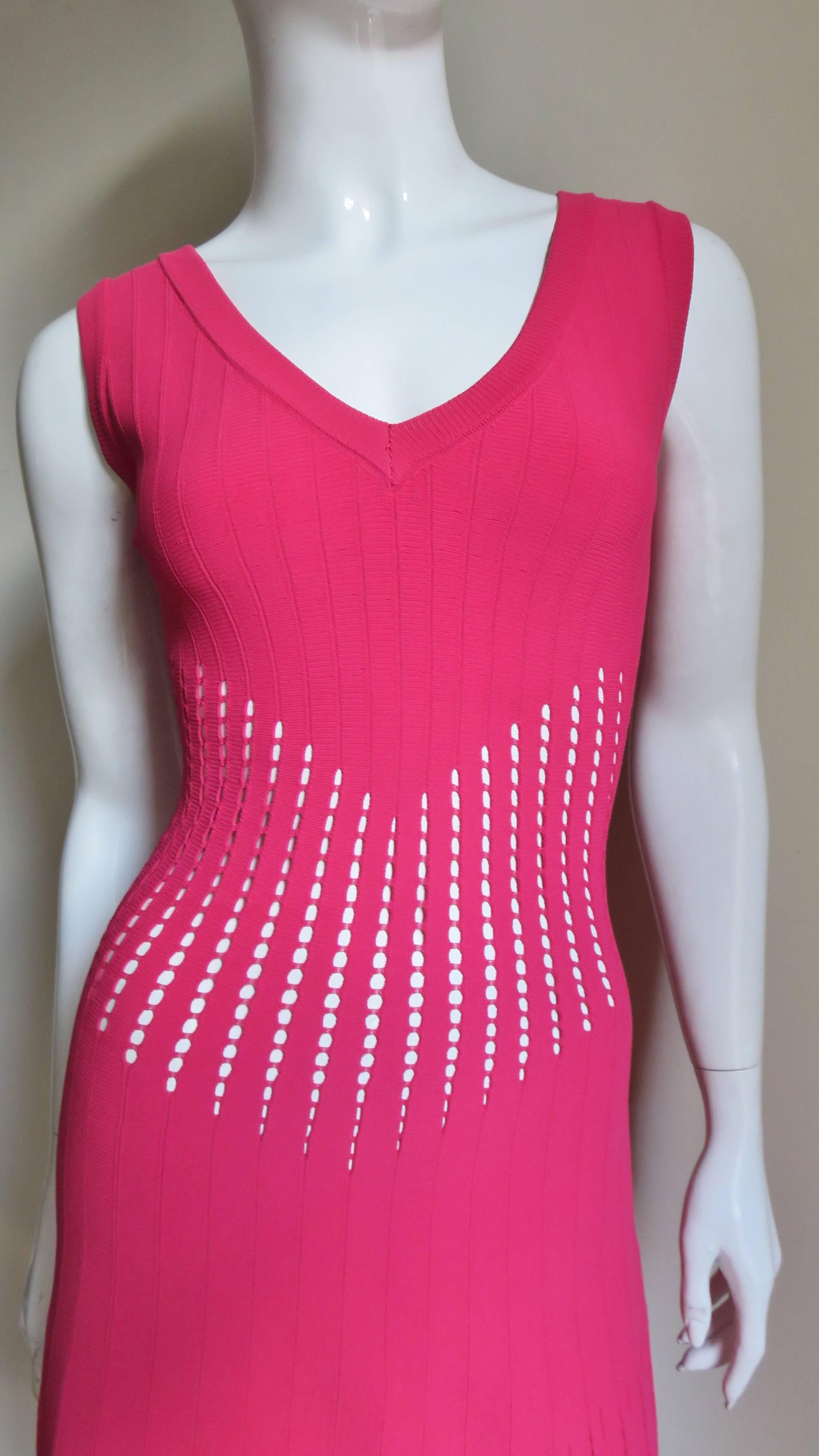 A gorgeous bight pink bandage dress from Azzedine Alaia comprised of 1