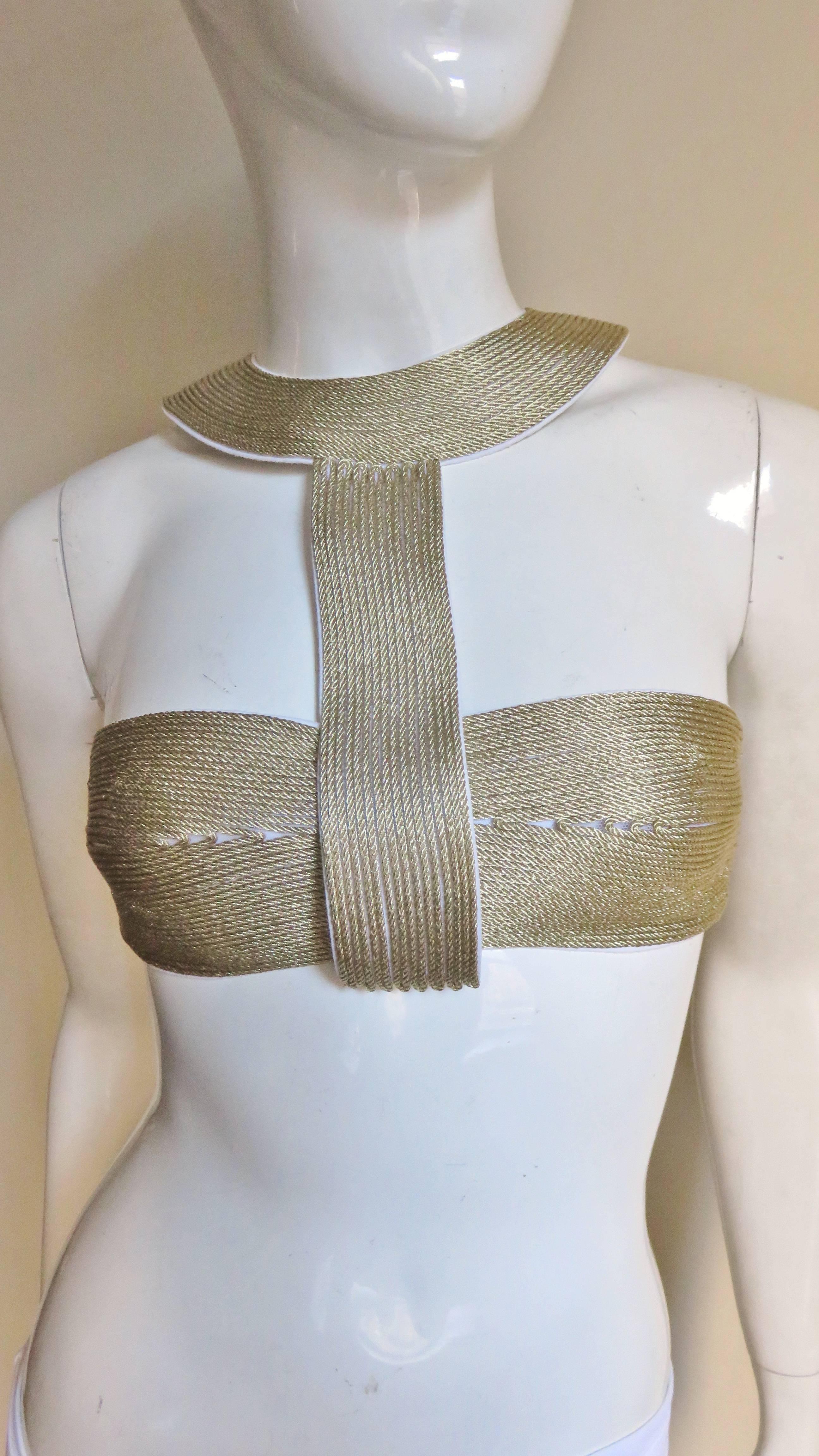 This is a gorgeous bikini by La Perla in white and gold.  The top is comprised of 2 pieces, a bandeau which can be worn on it's own and a Cleopatra collar consisting of rows of gold braid (which the bandeau slides through).  Gorgeous!  The back of