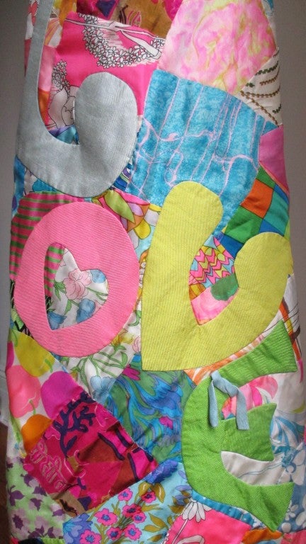 A fabulous silk patchwork maxi skirt, a great example of the 1960s Peace and Love generation from Elizabeth Arden.  Both the front and back are entirely comprised of brightly colored patches of patterned silk hand sewn together with the letters L O
