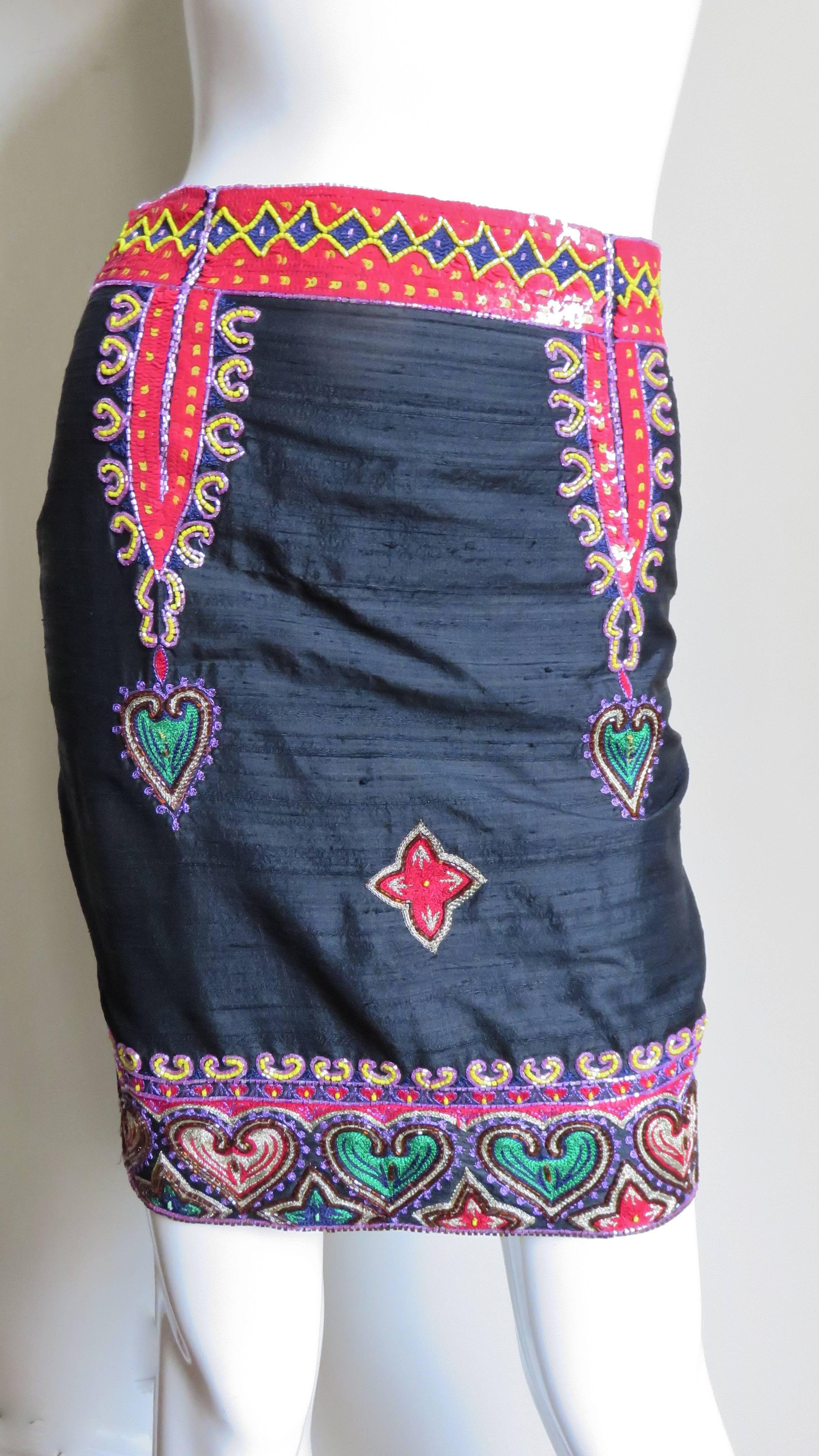 A beautiful black silk skirt trimmed in red sequin and embroidered hearts framed in an intricate beaded design.  It has a 2