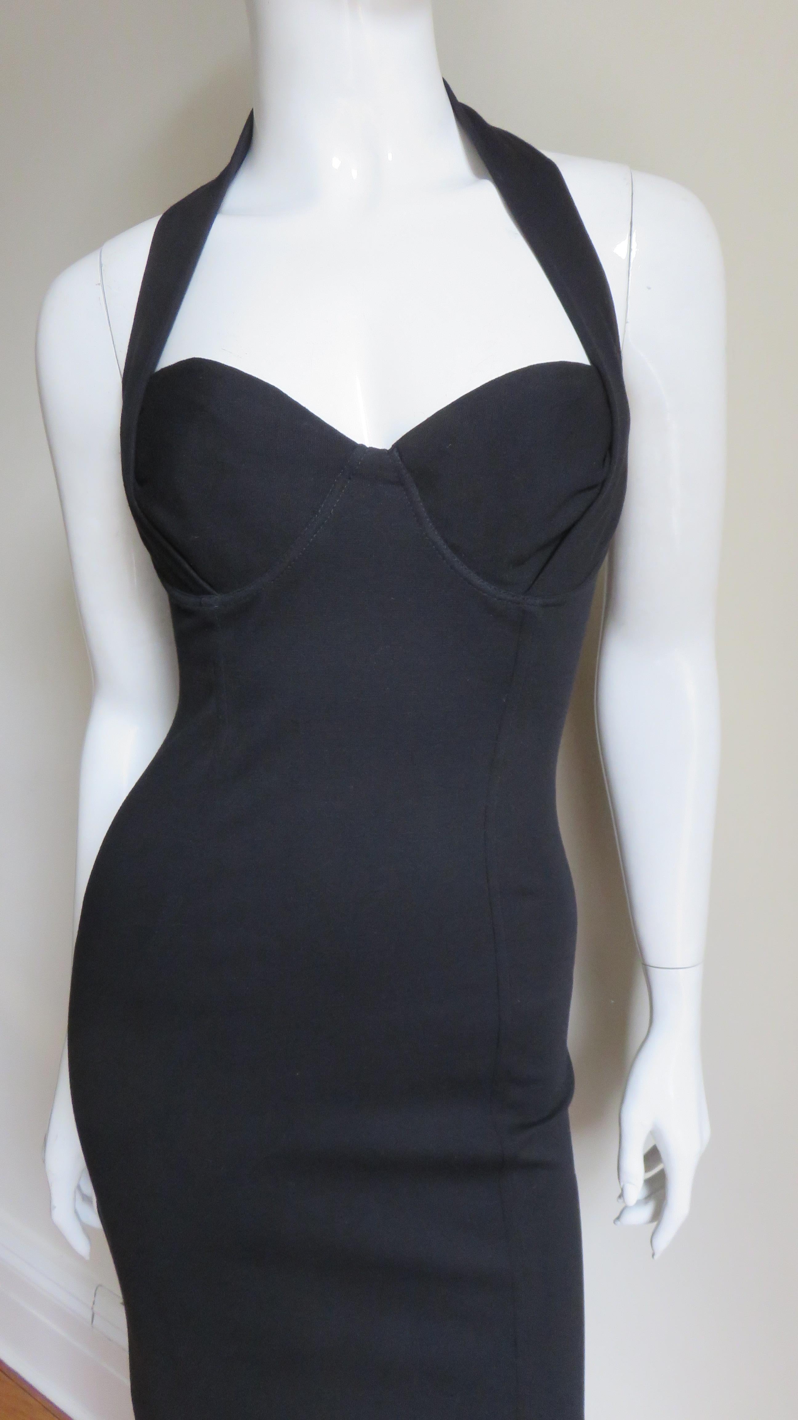 A great black cotton blend stretch halter dress by Jean Paul Gaultier.  It has sweetheart neckline and softly molded underwire bra cups with the halter strap extending over them.  The dress is fitted with lacing up the entire length of the back.  It