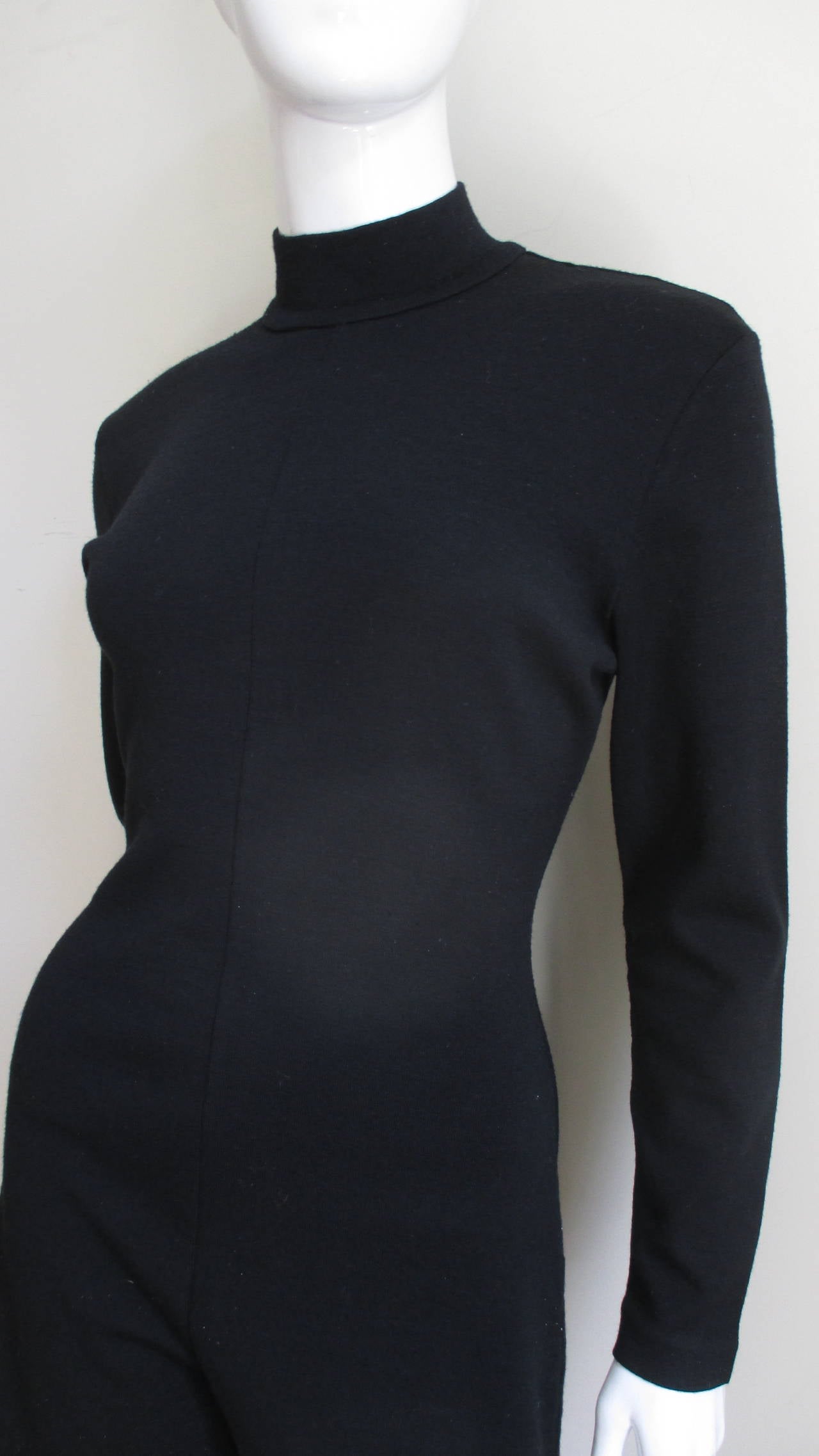 A great Claude Montana black wool jersey shorts jumpsuit with long sleeves and a stand up collar.  It has a back zipper and is unlined.
Sizes Extra Small, Small, Medium.

Bust  34-36