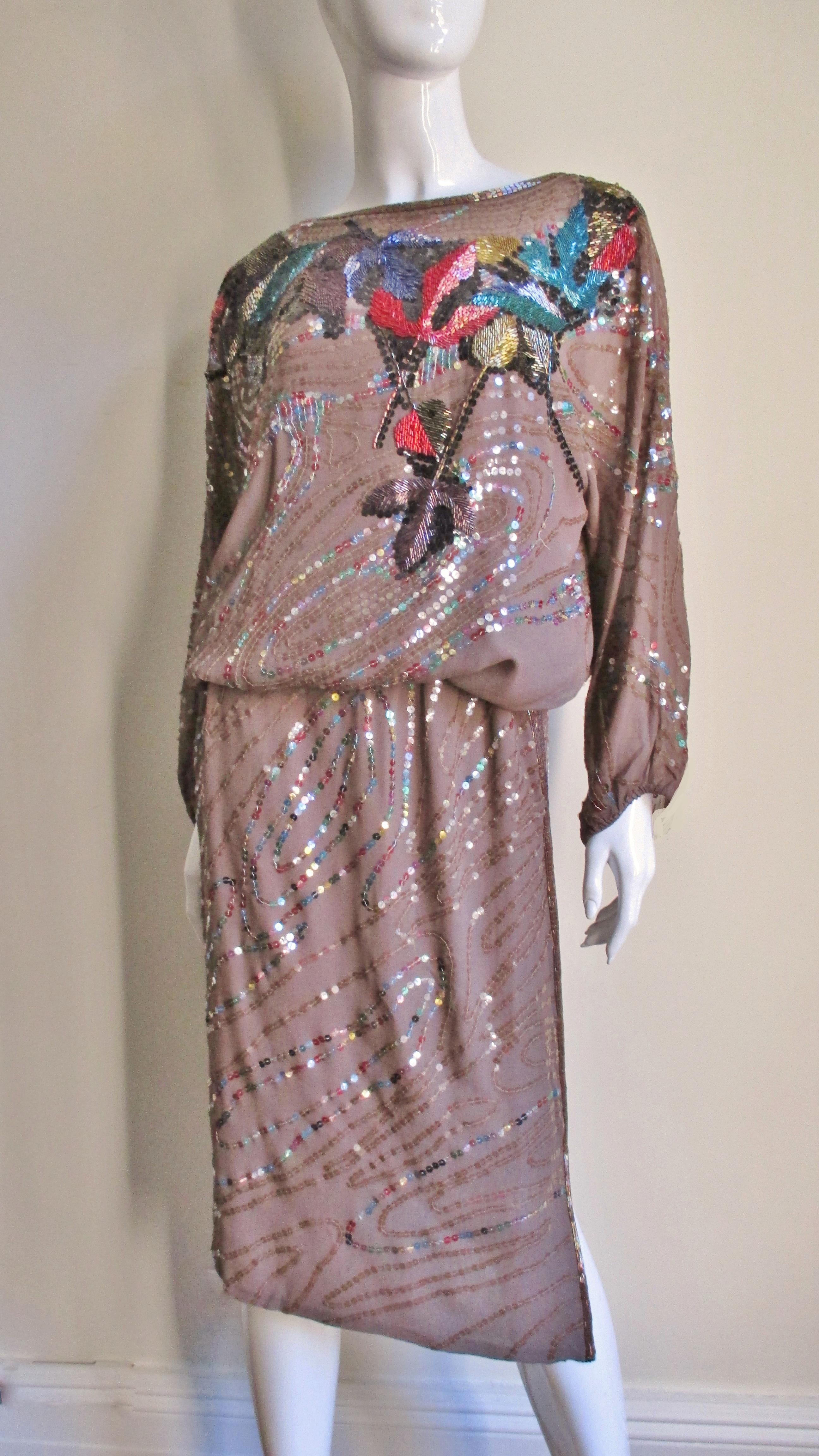 A gorgeous 2 piece tan silk top and skirt set from designer Neil Bieff.  It is adorned with an abstract pattern of sequins and glass beads created by world renowned artist Arturo Herrera whose works are exhibited in the Museum of Modern Art among