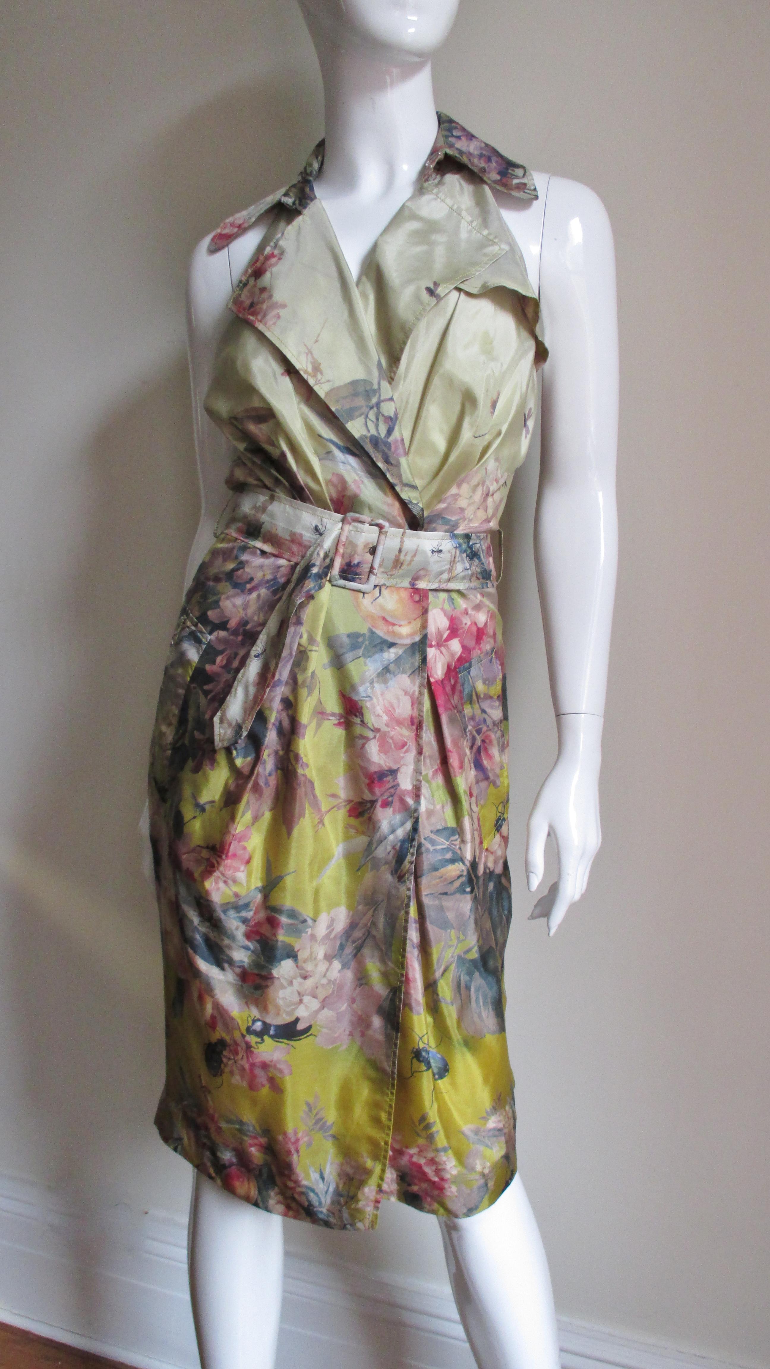 A great dragonfly and flower pattern silk dress from Jean Paul Gaultier in shades of yellow, green, gold, coral and pink on an ombre yellow background.  It is a wrap style with cut in shoulders, a lapel collar which can be worn open or closed, front