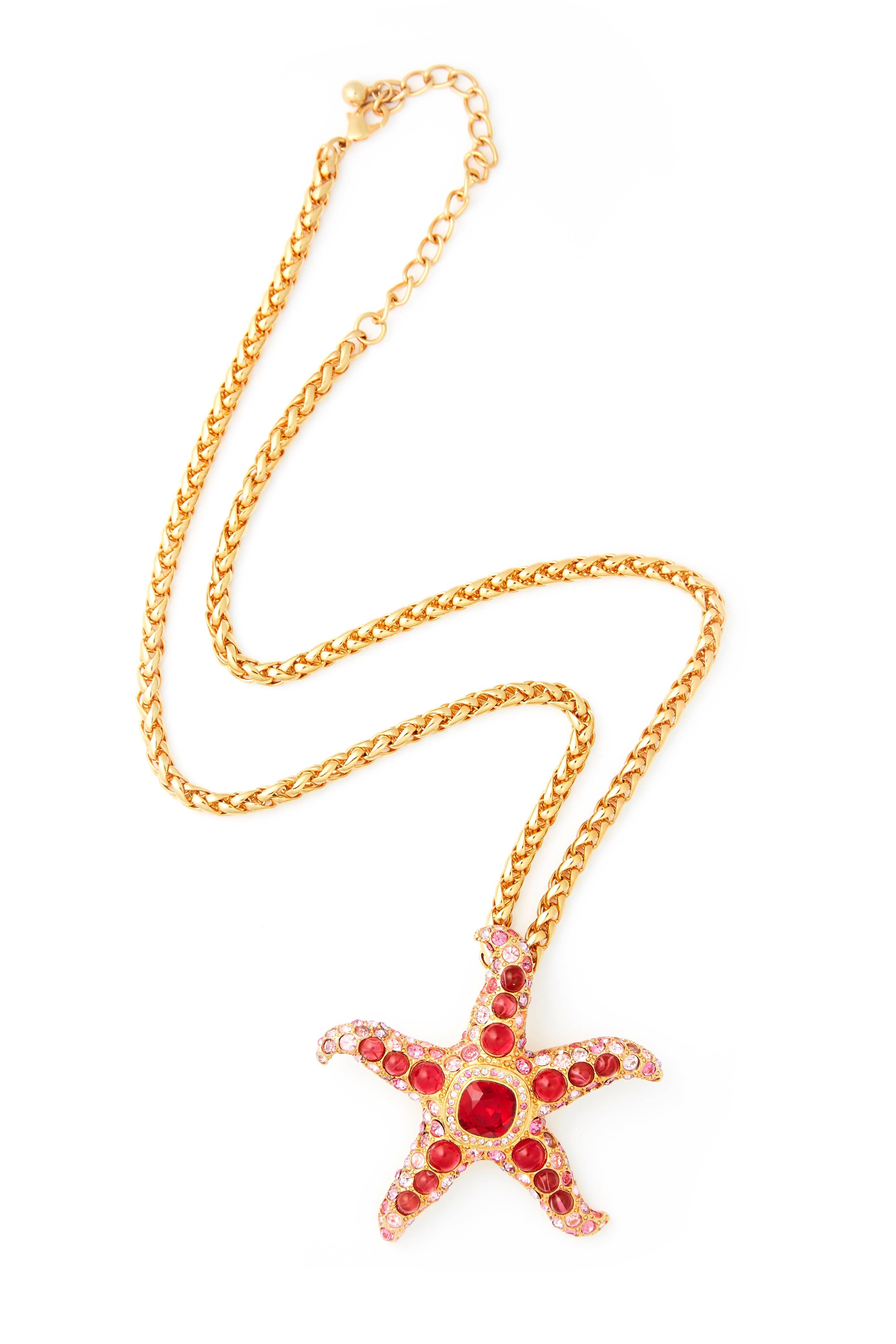 Starfish pendant with Red and Pink crystals on a 33 cm gold plated chain> Finished with a 10 cm extender for the perfect fit. 