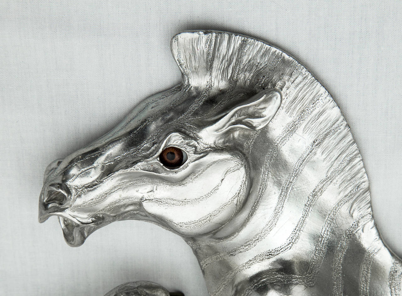 A Sensational Sculptural Silver Zebra Belt Buckle by Christopher Ross; brown glass set in zebra's eye; approx. dimensions: 6