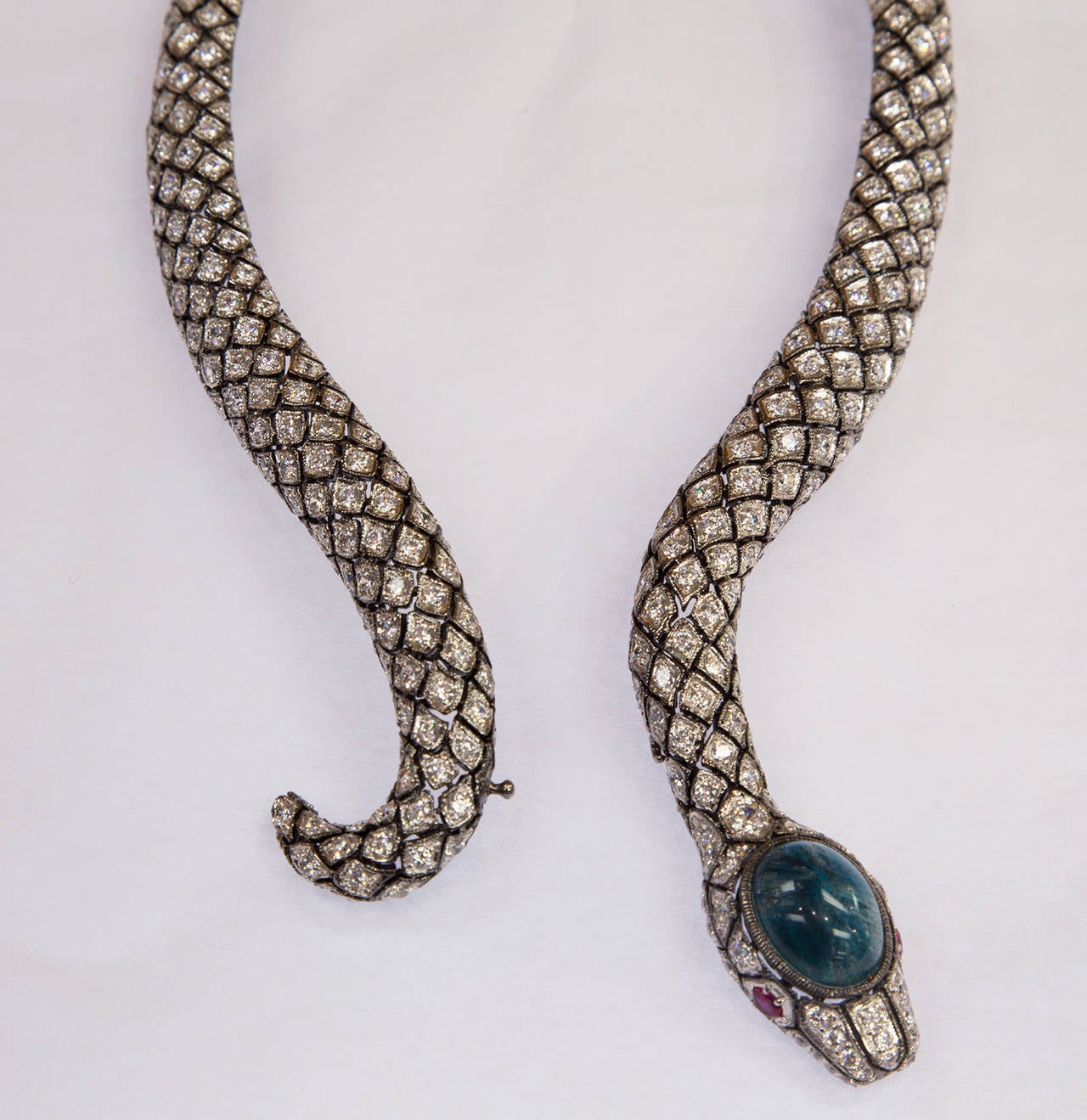 Stunning Sterling Silver signed Serpent Necklace encrusted with Crystals, the head set with a large oval cabochon simulated Emerald stone; all set in sterling silver with black rhodium finish; Approx. 16
