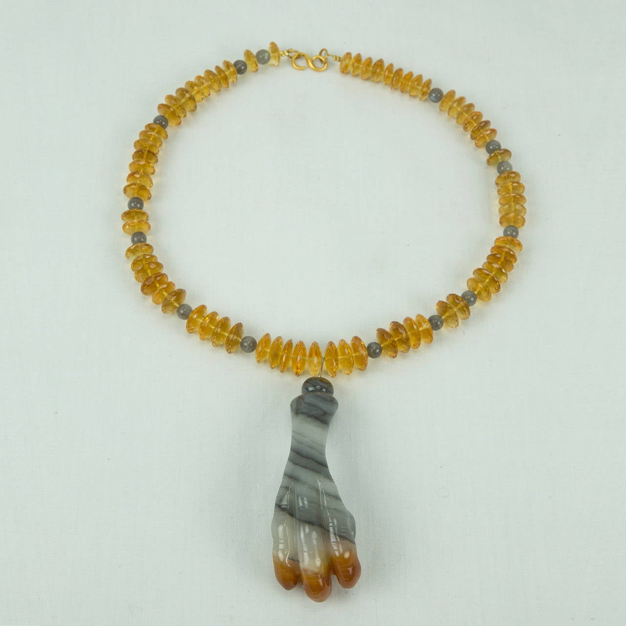 Awesome Facet-cut Citrine Necklace inter-spaced with Labradorite stones, suspending a hand carved Agate Pendant, depicting an Eagle Claw clutching a Fish, symbolizing Prosperity; held by a Gilt S/S clasp; necklace measures approx. 17.5” long and the