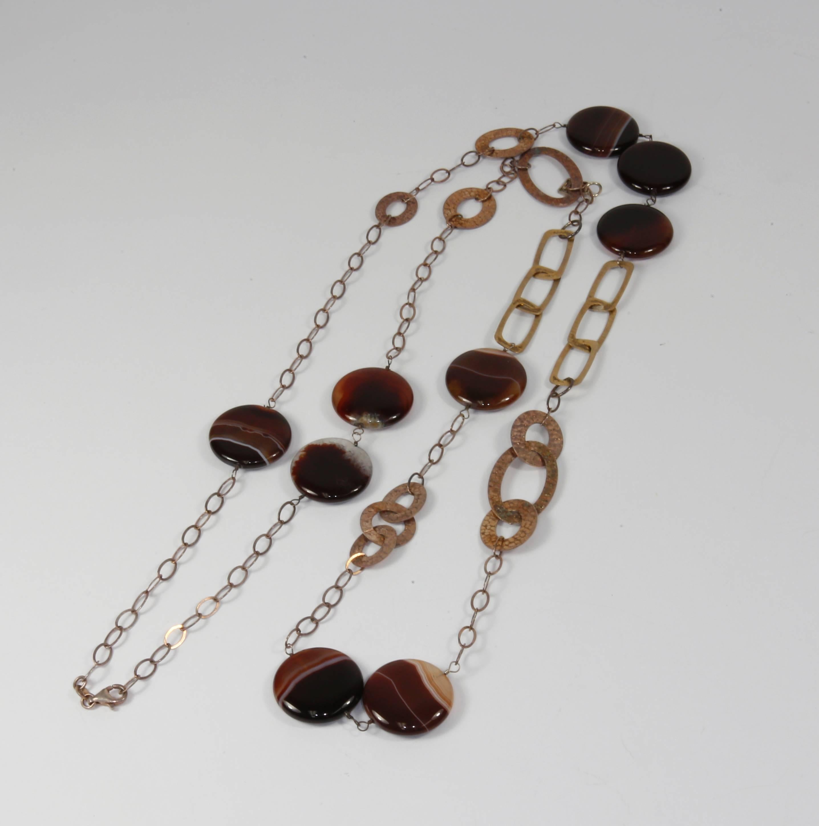 Fabulous Long and Bold sterling silver and banded agate chain necklace; comprising multi-shaped sections of sterling silver links,  alternating with large banded agate beads. The large banded agate beads are smoothly polished and display wonderful