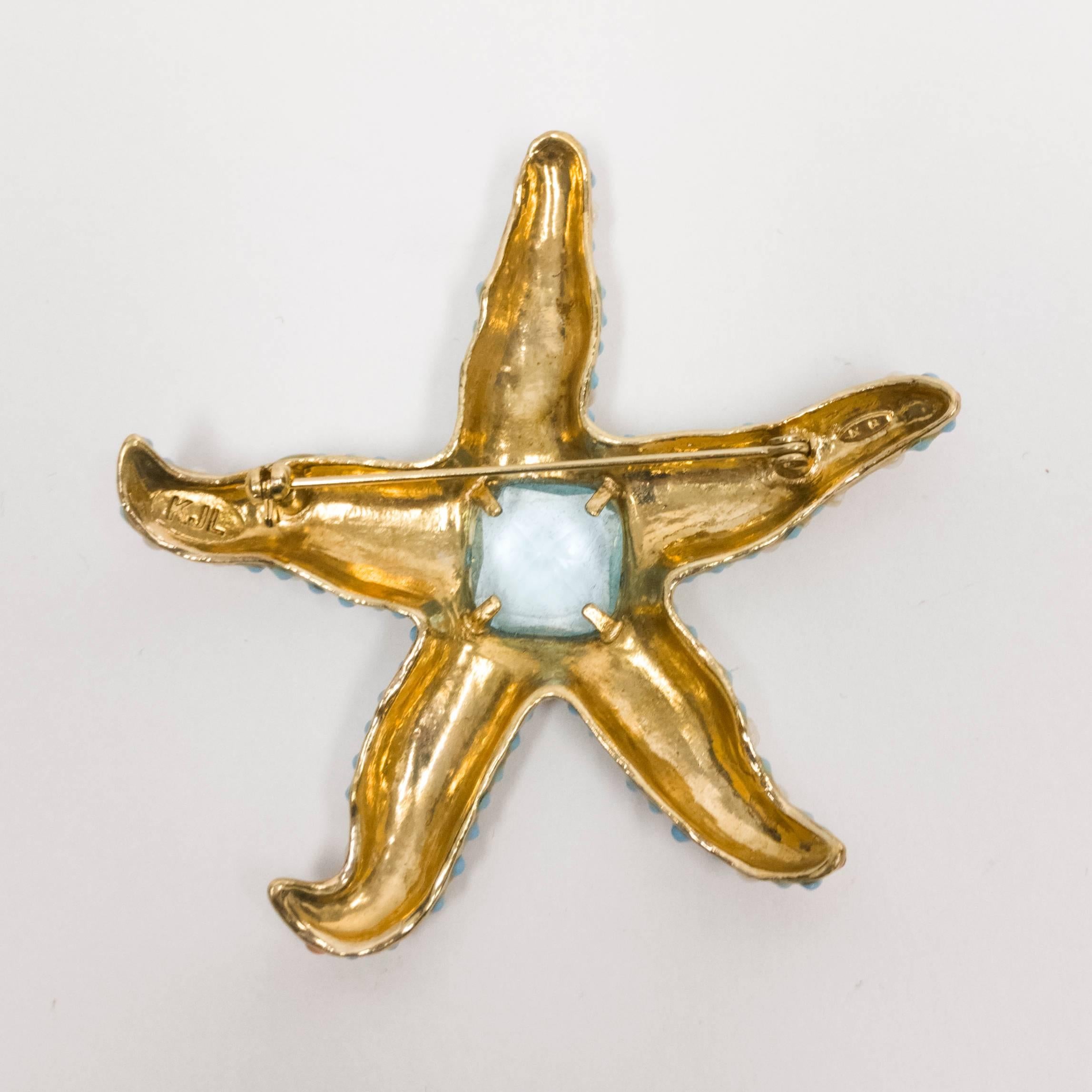 Stunning KJL Kenneth Jay Lane Large starfish in gold tone metal center set with a large faux Aquamarine, down the center of each leg set with orange cabochons surrounded by faux pearl and turquoise; approx. size: 3