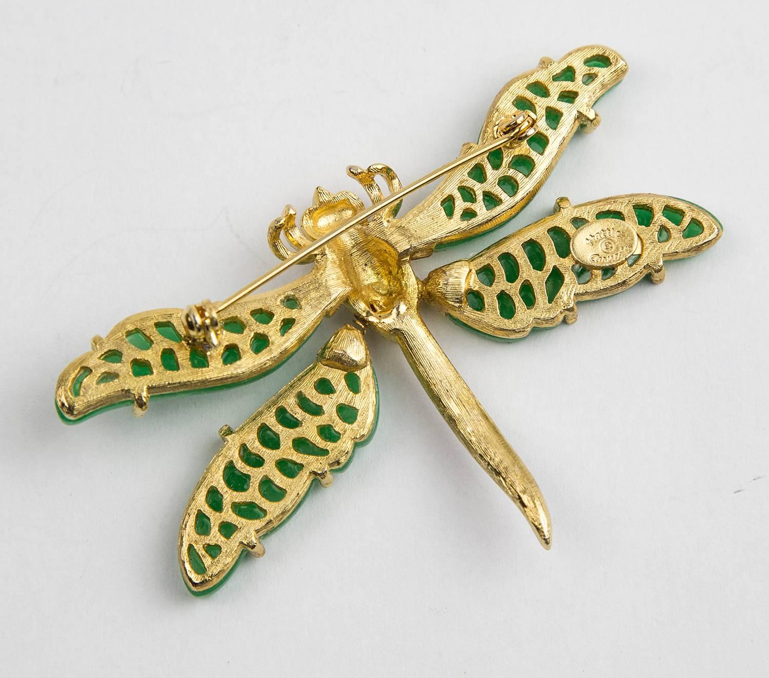 Beautiful HATTIE CARNEGIE Tremblant Dragonfly Statement Pin, faux Jade wings, enhanced with CZ rhinestones; set in a gold- tone metal body. Signed: Hattie Carnegie in the script on reverse. Approx. size: 3