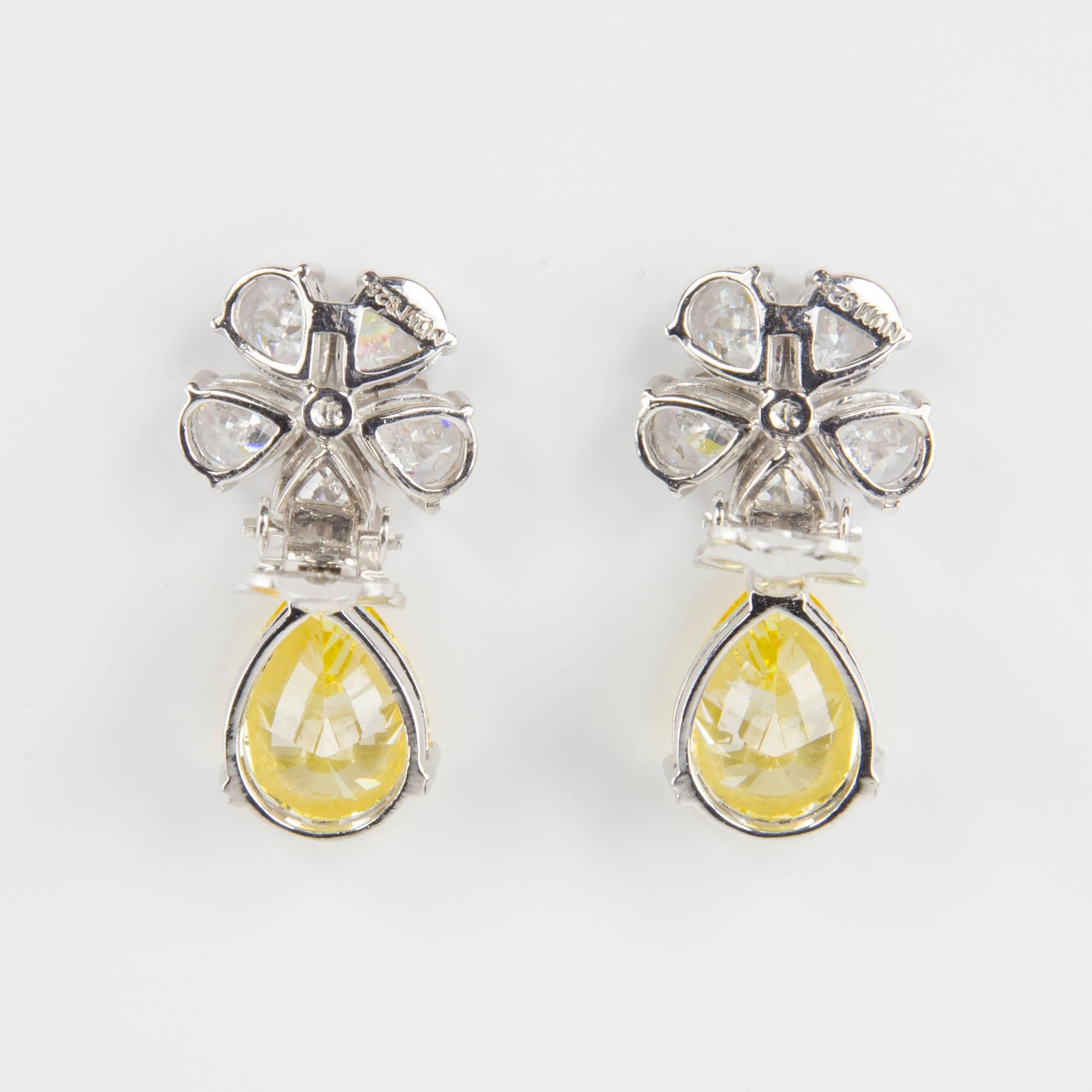 Stunning… Pear shapes Cubic Zirconia form a Daisy, suspending large pear shape faux Yellow Diamond, making a striking statement! All hand set in Sterling Silver. Faux Diamond flower measure .50” diameter and each faux Yellow Diamond drop measures
