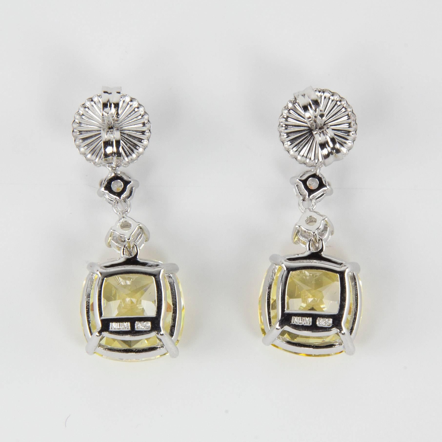 Simply Beautiful…each dangle earring is set with  6mm and  4mm round Faux Diamonds, suspends a large 22mm square cushion shape faux Yellow Diamond, making a striking statement! All hand set in Sterling Silver. Approx. total length 1