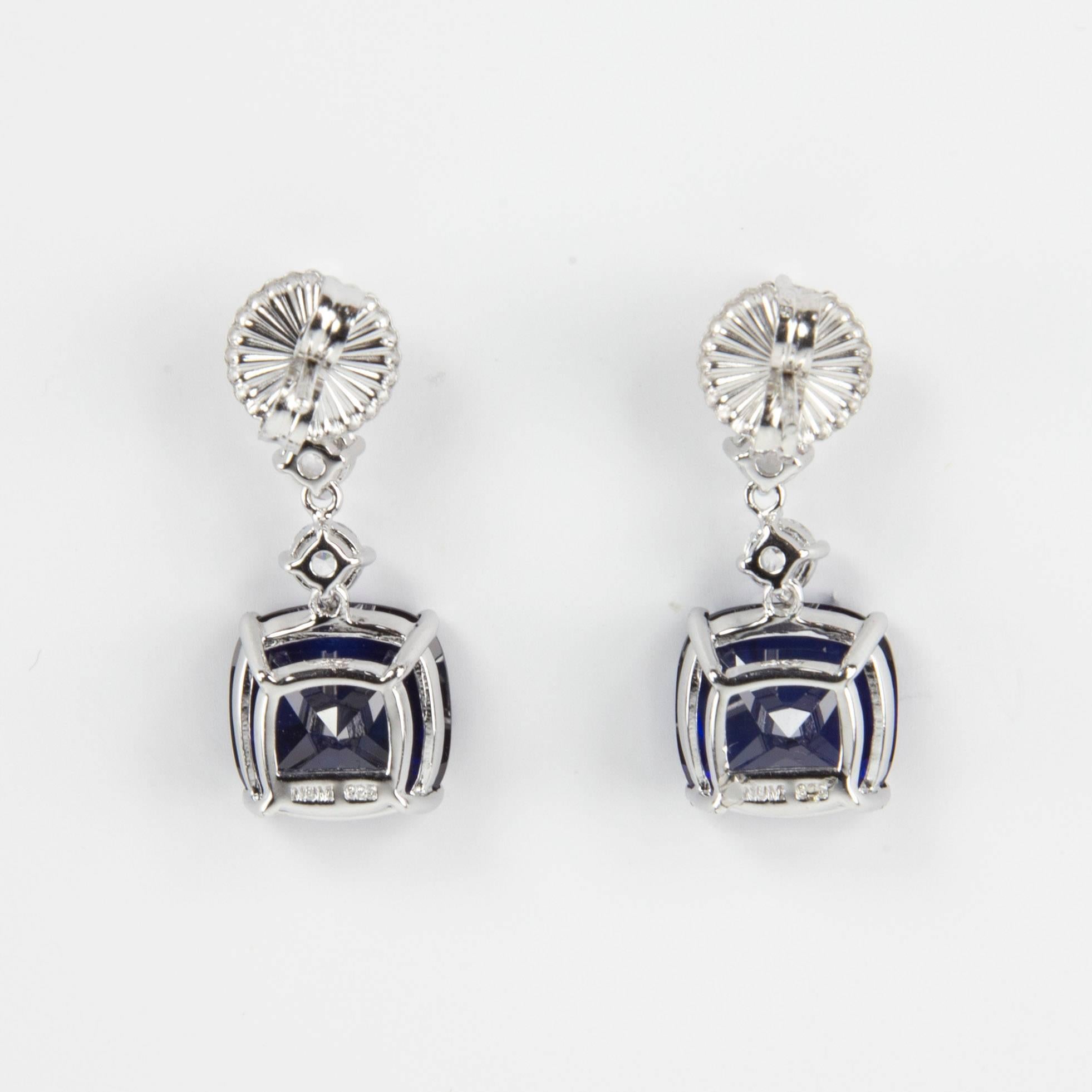 Simply Beautiful…each dangle earring is set with a 6mm, 5mm and 4mm round Faux Diamond, suspends a large 22mm square cushion shape faux Blue Sapphire, making a striking statement! All hand set in Sterling Silver. Approx. total length 1.25