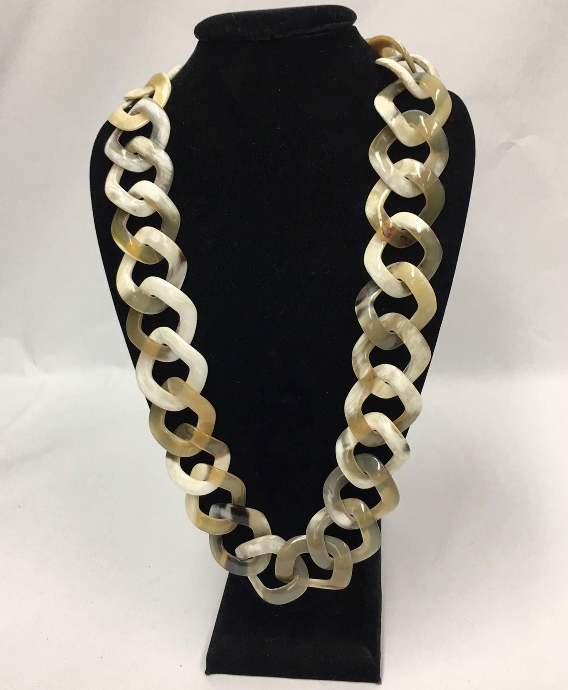 Beautiful and Stylish, this square Faux Horn Runway Link Necklace is easy to wear, lightweight, and a perfect complement to every wardrobe… Illuminating your Look with a touch of Class! 

