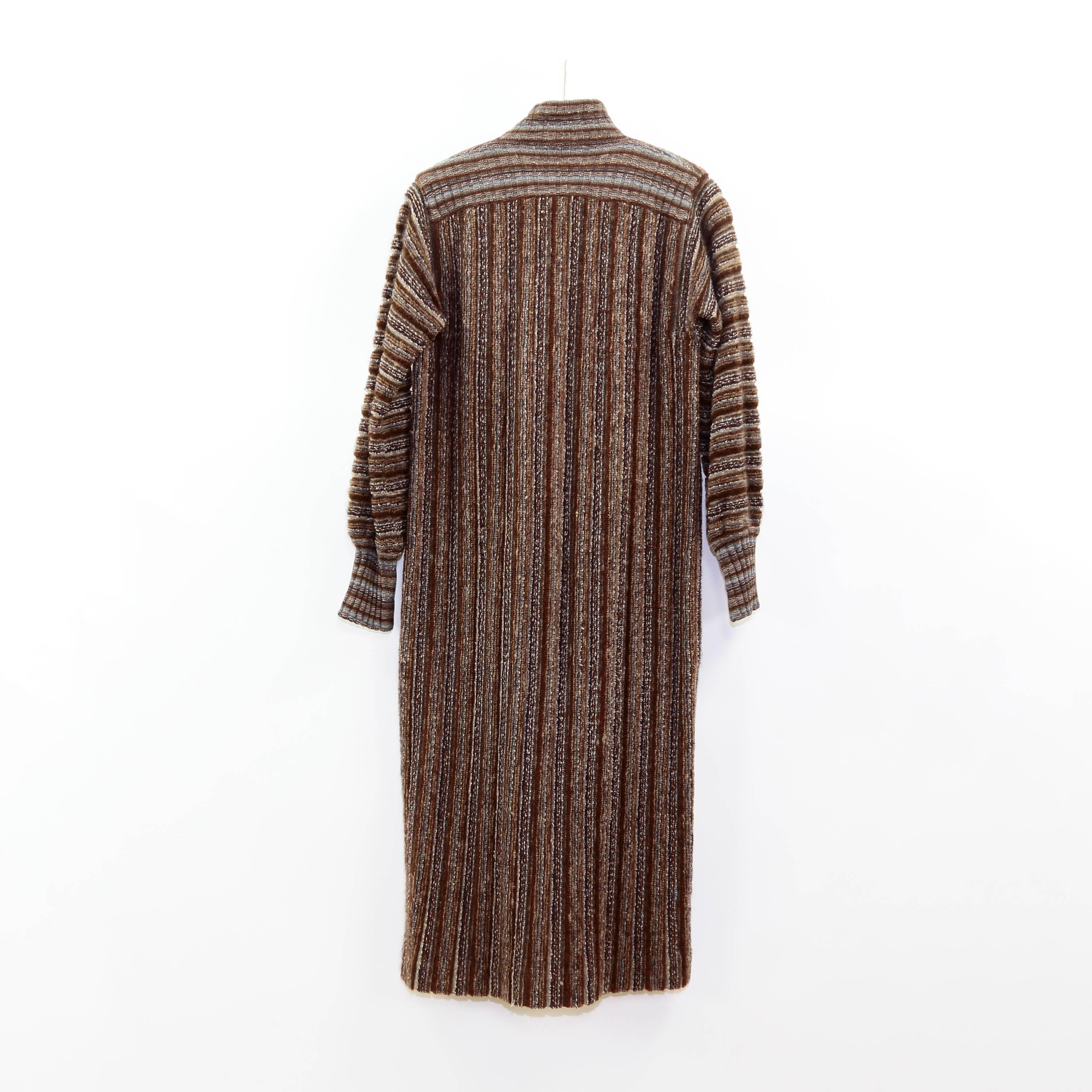 Missoni Woman's Long Striped Knit Italian virgin wool Coat; with striped brown, beige, cream, and blue knitted pattern throughout; Front button fastenings Fastens with covered buttons; 100% Pure New Wool. Perfect for fall and winter; A fabulous