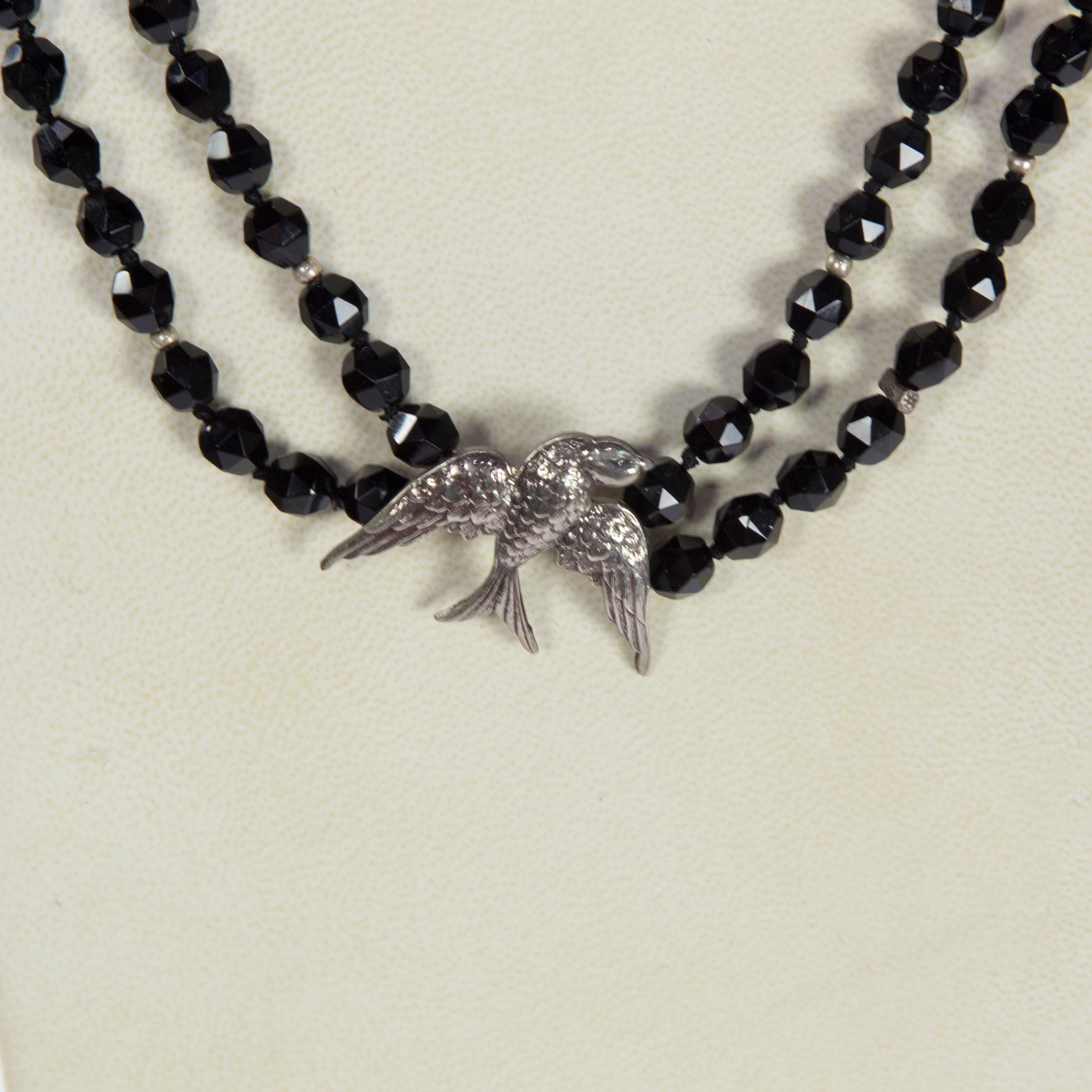 Awesome Faceted Onyx Beads Necklace inter-spaced with Sterling Silver spacers and centered by a Sterling Silver Swallow Bird; newly hand strung and knotted; Approx. 52