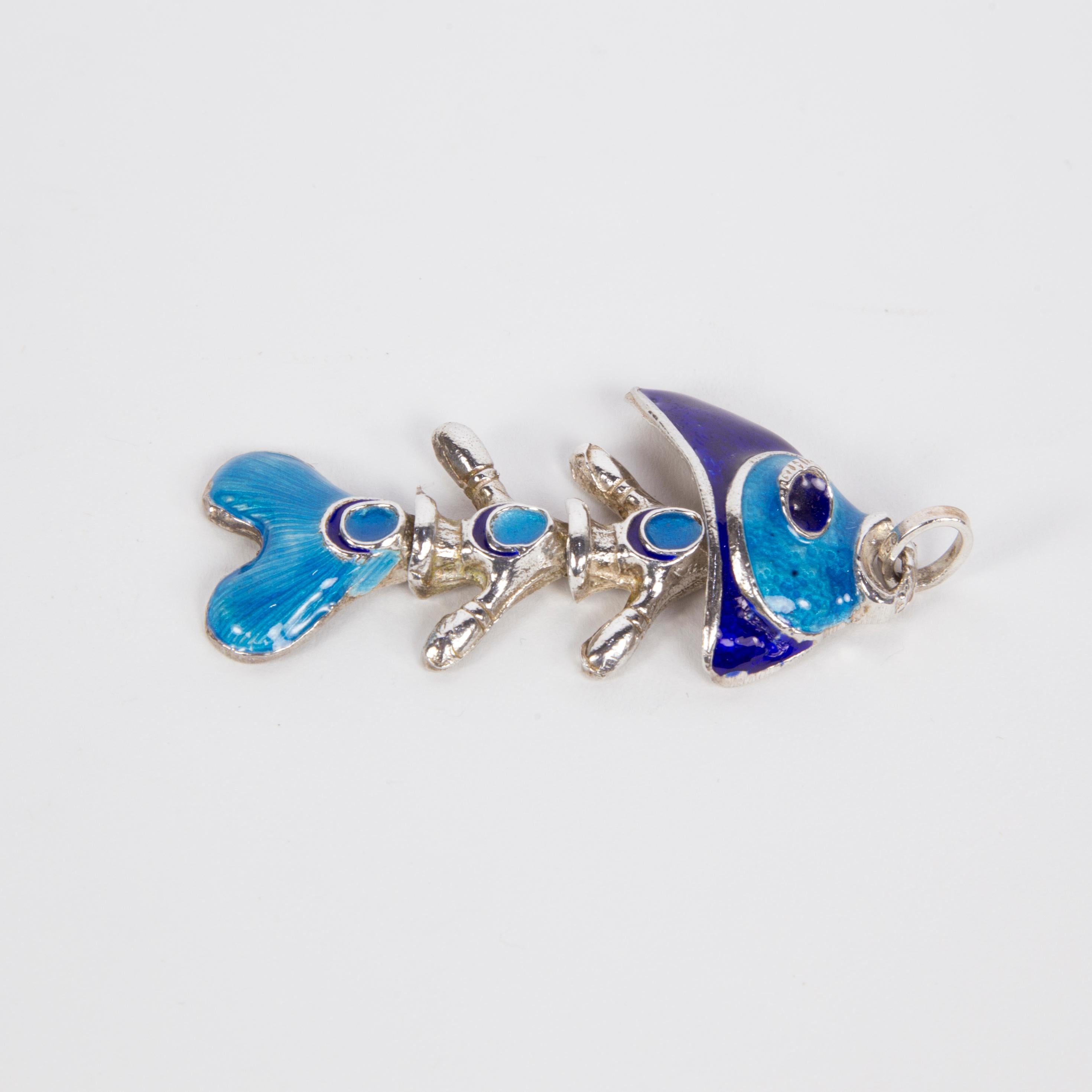 Beautiful Vintage cloisonné enamel articulated Sterling Silver Fish pendant; striking colors of turquoise blue and navy blue; measuring approx. 2.50” long including bale. Add an alluring touch to any ensemble with this beautiful necklace! 
