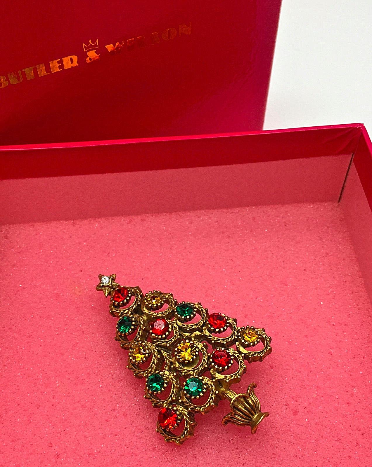 Designer signed BW Butler & Wilson Christmas Tree Brooch set with sparkling Faux Multi Gemstones in Gold tone mounting; approx. 2.25 inches high.  A Must Have for that Special Someone…Including You!  Enjoy the Holidays! 
