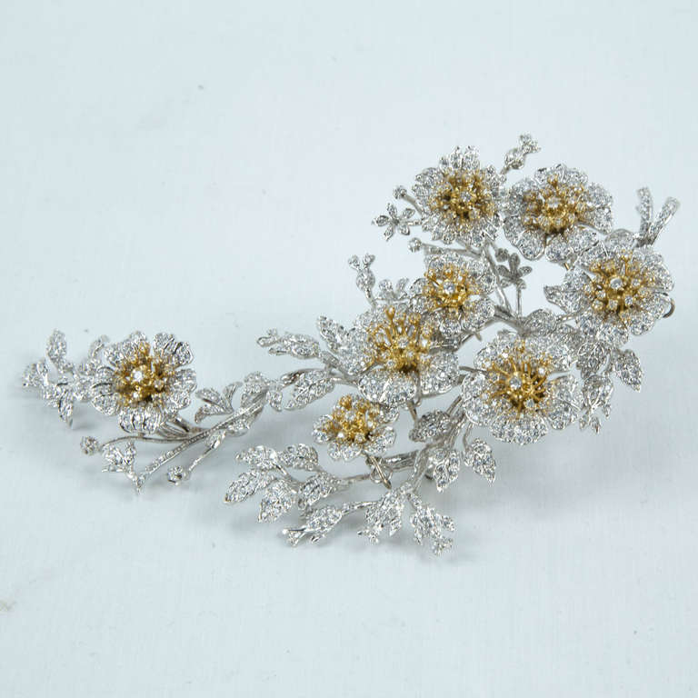 Beautiful en tremblant cascading Multi Flower pin brooch in Sterling Silver, encrusted with Swarovski crystals, gilt accents on flowers; signed: Jarin Sterling approx. size: 6 inches x 3 inches (at widest point). Elegant and Stylish! Fun and