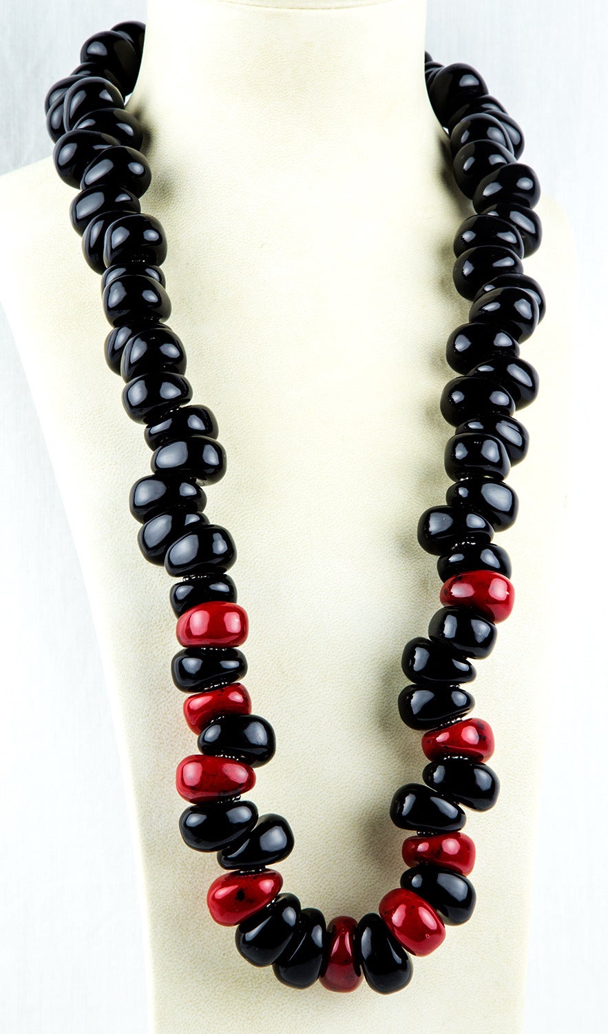 Fabulously Dramatic Black and Red Celluloid Necklace, the oval curved celluloid discs, each measuring an impressive 26. 5mm x 22mm are inter-spaced with flat silver rondelles. The necklace measures approx. 36” long. C1980s. Chic and Show Stopping