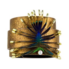 Stylized Peacock Feather Pendant on Leather Cuff Bracelet