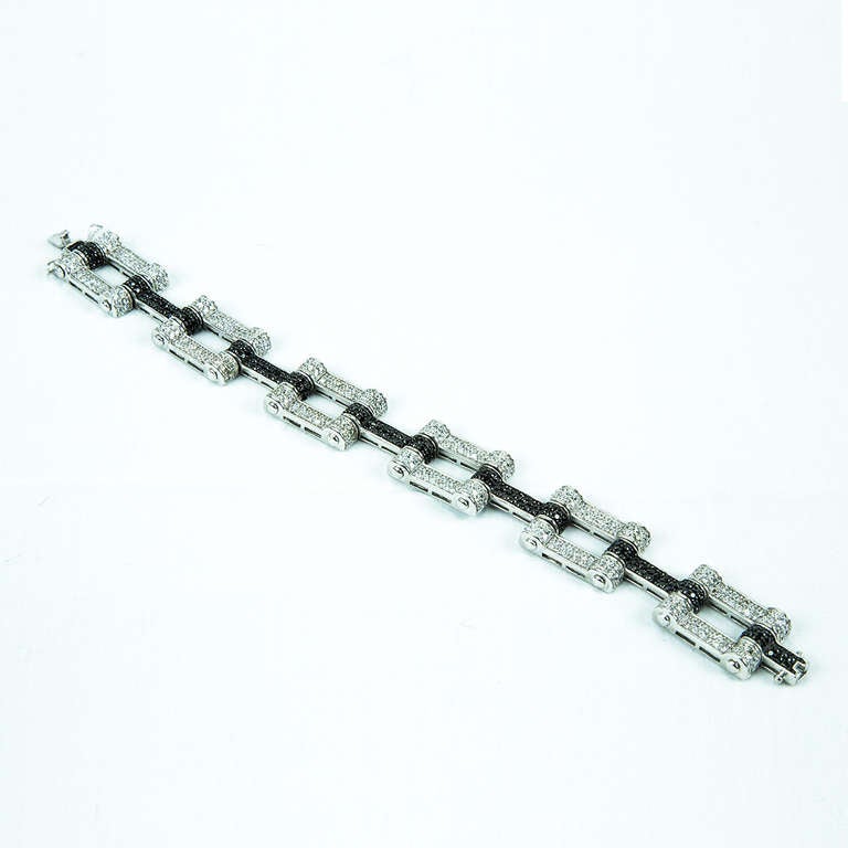Classic Sterling Silver Bracelet, each open link is encrusted with white CZ and each bar with black CZ; creating a fabulous contrast! Rhodium Plated; measures approx. 8.75” long. Day to evening in Style and Grace!