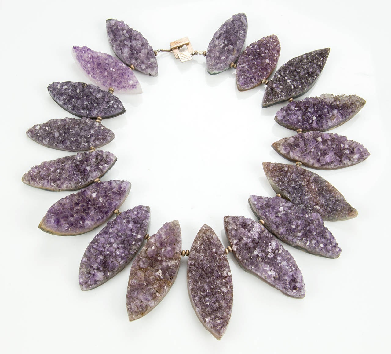 Outstanding Runway Necklace features seventeen Beautiful Genuine Natural Gem Amethyst Druzy Quartz, inter-spaced with Sterling Silver rondelle Beads; Necklace held by a square toggle Sterling Silver Clasp. The tapered Marquise Navette shaped