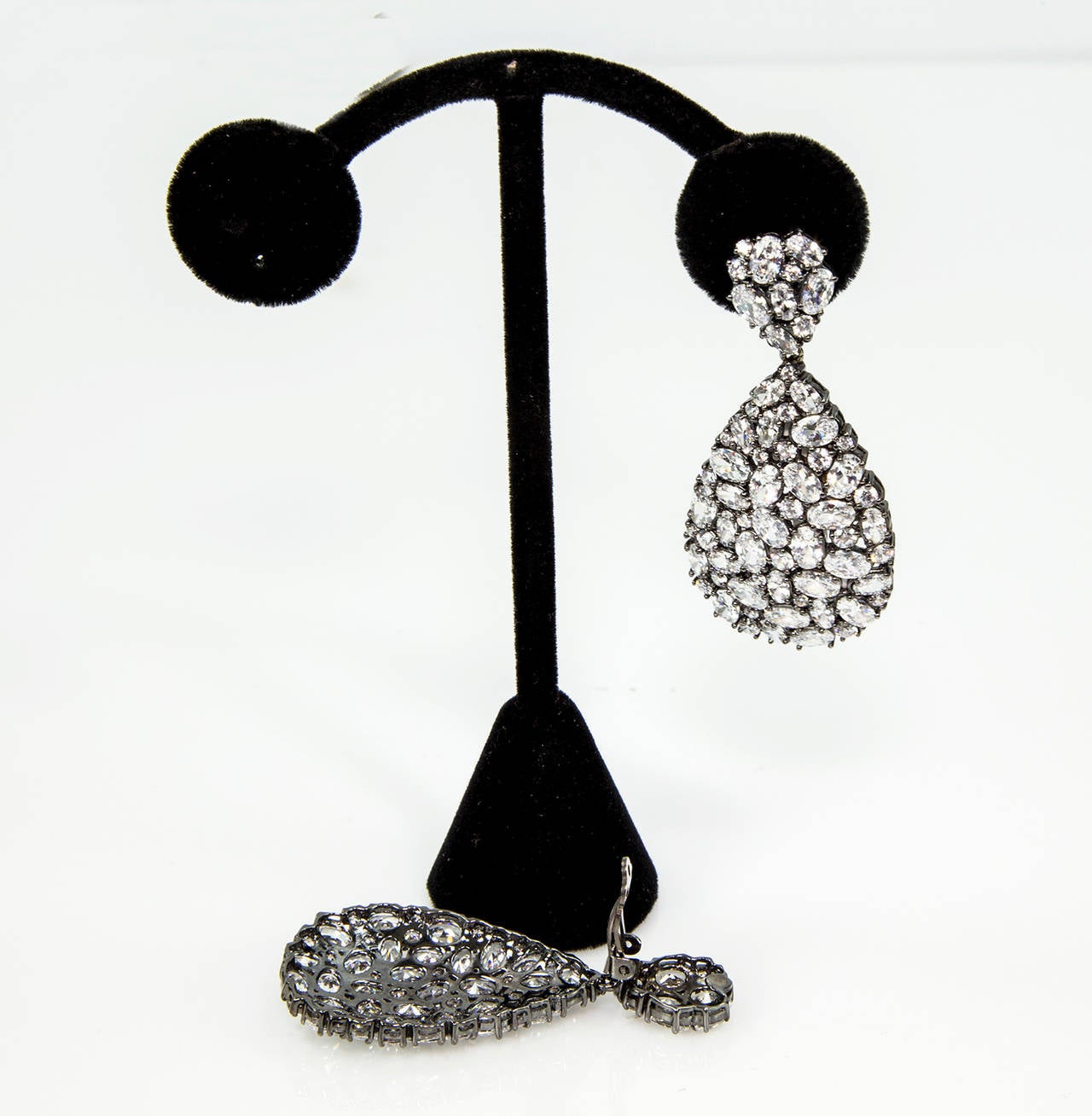 Beautiful double Teardrop design Dangle Earrings, crafted in Black Rhodium plated sterling silver and encrusted with sparkling Faux Diamond CZ; Teardrop pendant measures 1.5″ long, top Teardrop measures 0.5″ long;  Earrings measures 2.25″ total