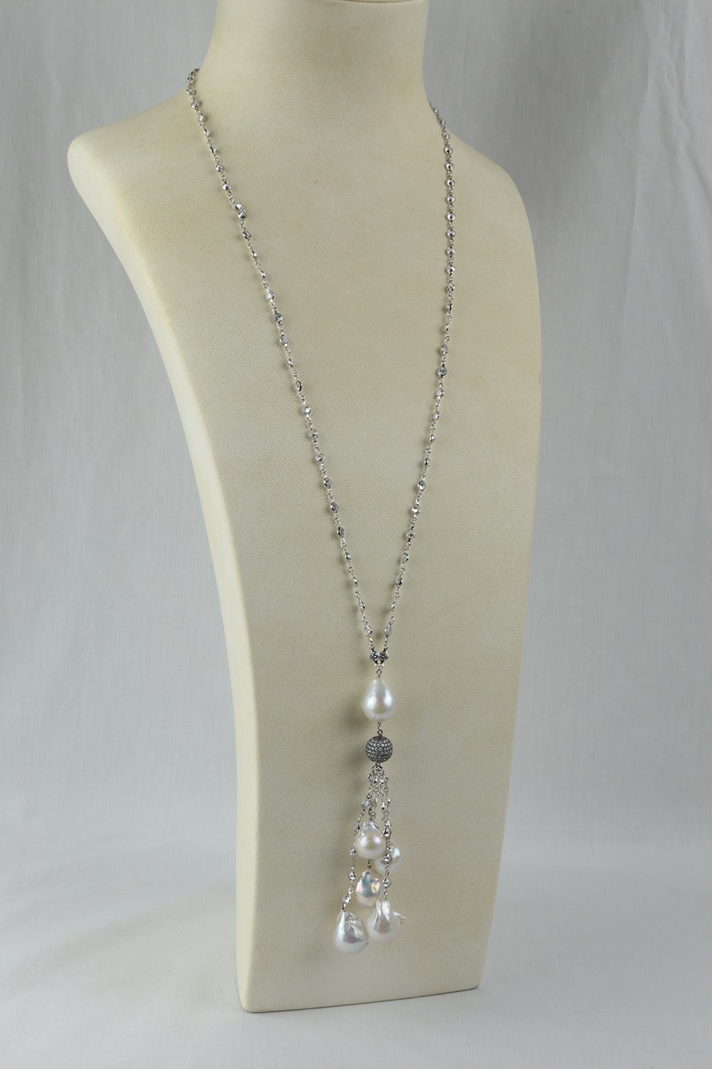 Fabulous Statement Necklace with Glittering Cubic Zirconium CZ, suspending cascading multi strands of large Cultured Freshwater Baroque Pearls, Sterling Silver CZ chains and a CZ encrusted Disco ball; approx. 32 inches; long plus 5” tassel. Classic