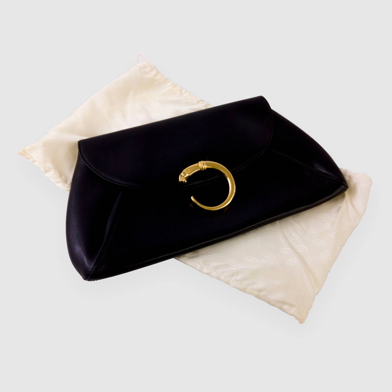 Chic CARTIER Black Leather Clutch Purse featuring a Gold Panther Closure; Striking Red interior with zipper; 14” x 7.5”; comes with original dust cover. A Must Have Timeless Classic you’ll turn to time and again!