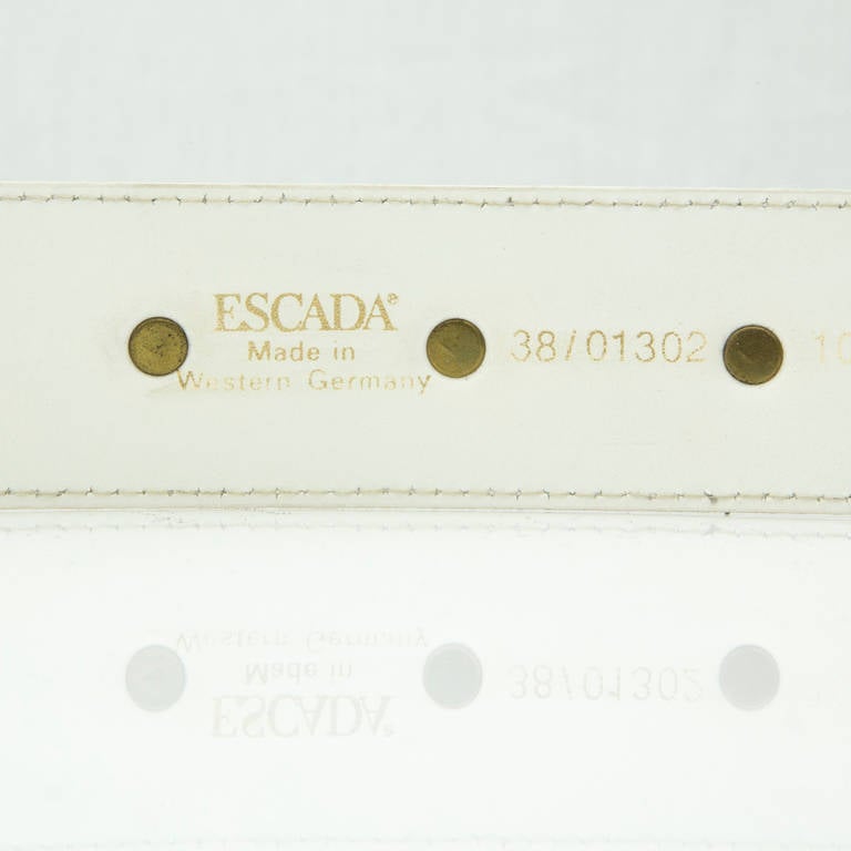 Escada Elephant Stud White Leather Belt with 3 Elephants and Pearl set decorations; Gold-tone hardware; White leather adjustable strap; Marked: ESCADA Made in Western Germany 38/01302 100; approx. 33.3” total length; 1st hole=28.5” last hole=30.5”;