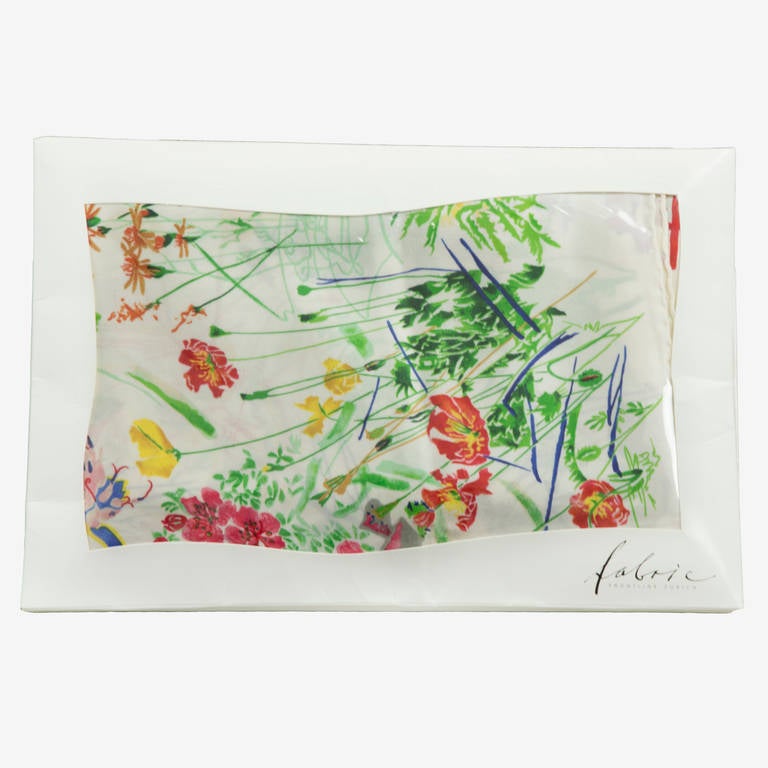 Beautiful Large Flora Scarf of the finest 100% Silk; hand rolled and silk-screen printing process with Designs that were drawn with a deep love of detail! This flora motif, a white background with multi colors flowers became an Iconic symbol;
